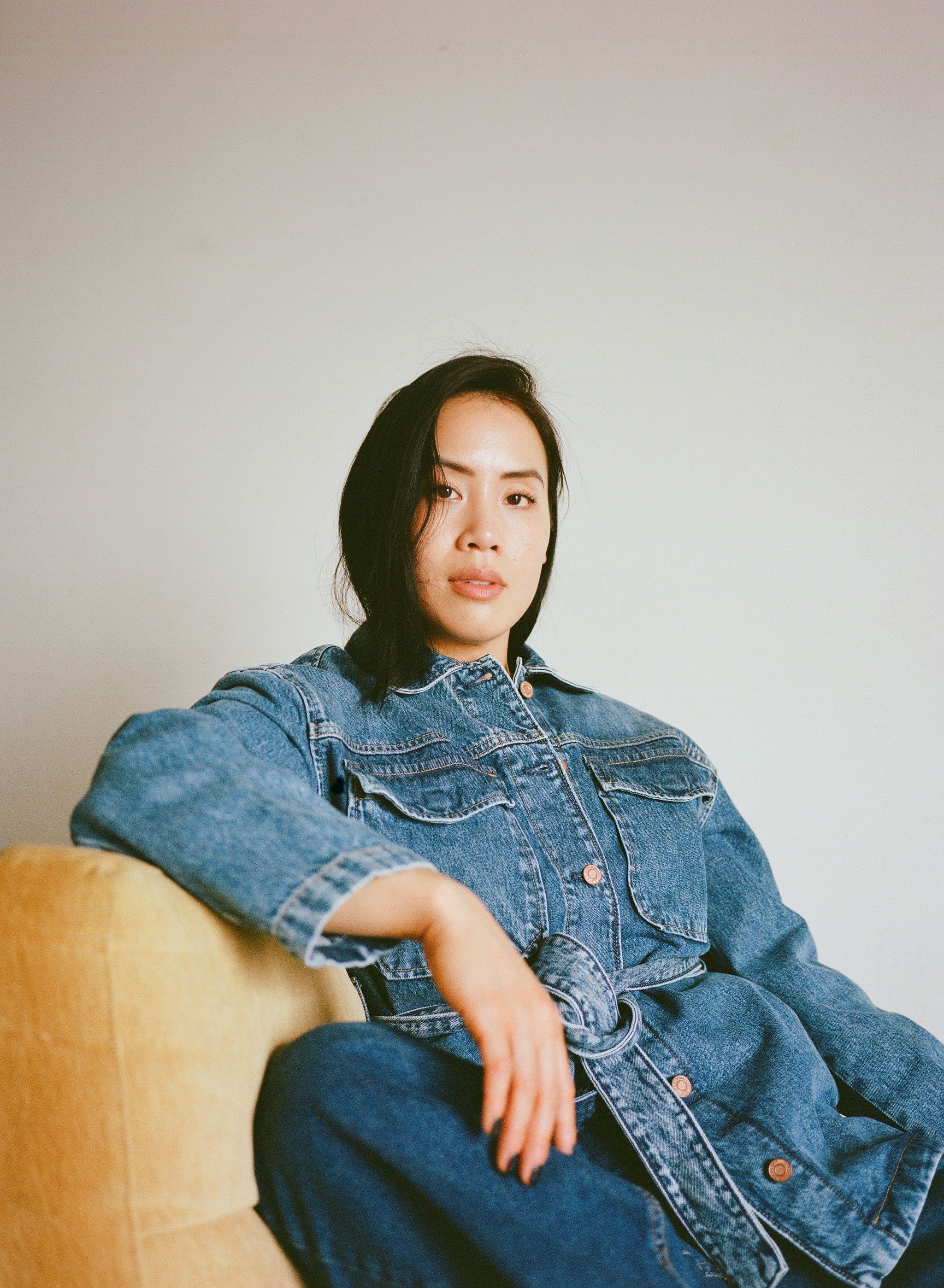 Woman with red hair covering mouth with hair