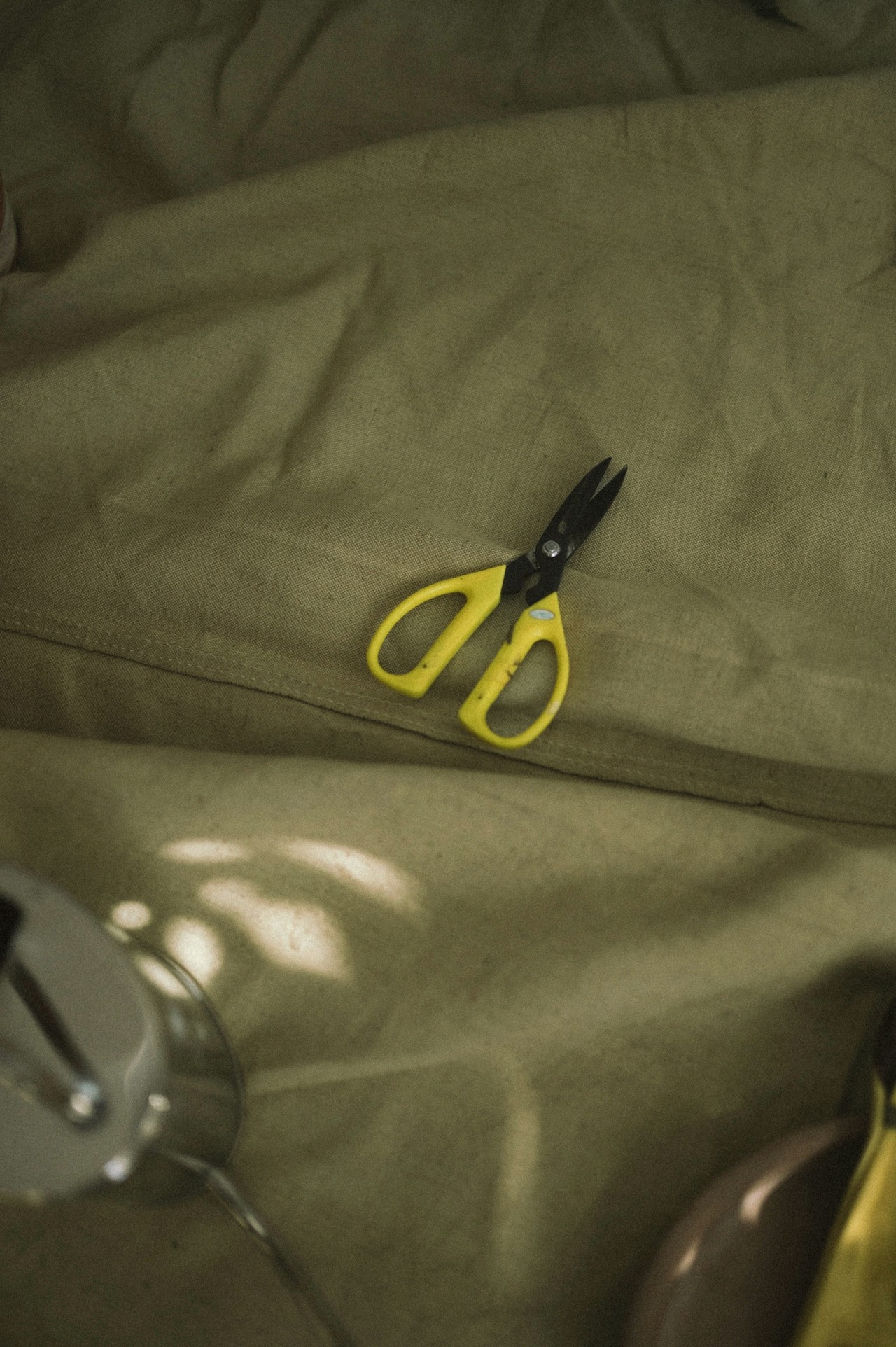 Yellow scissor on the ground