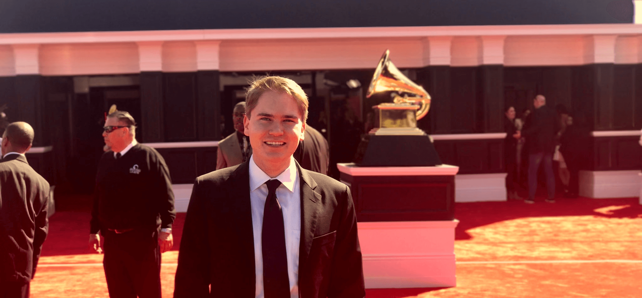 Alex standing on the red carpet at the GRAMMY awards
