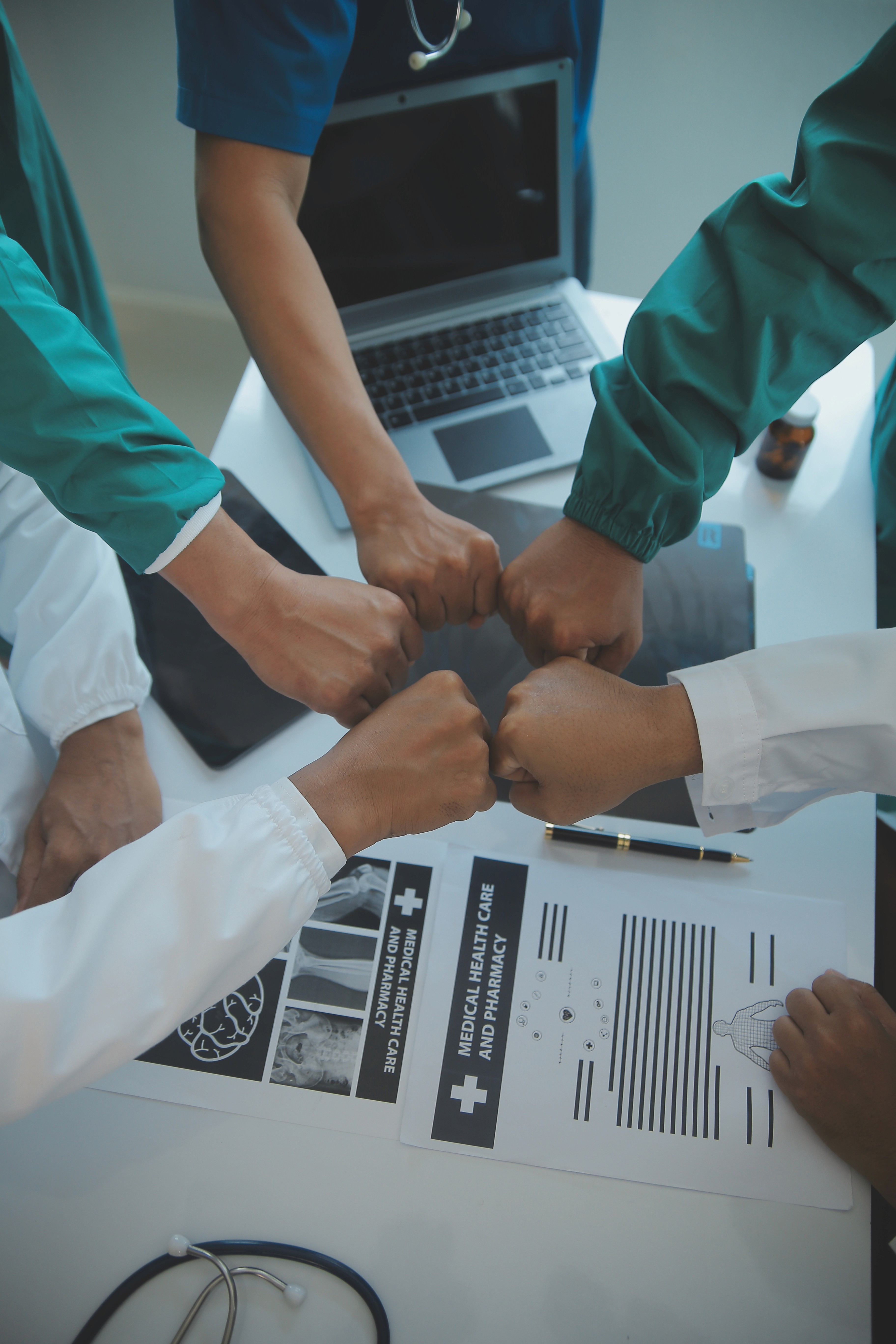 man standing behind flat screen computer monitor