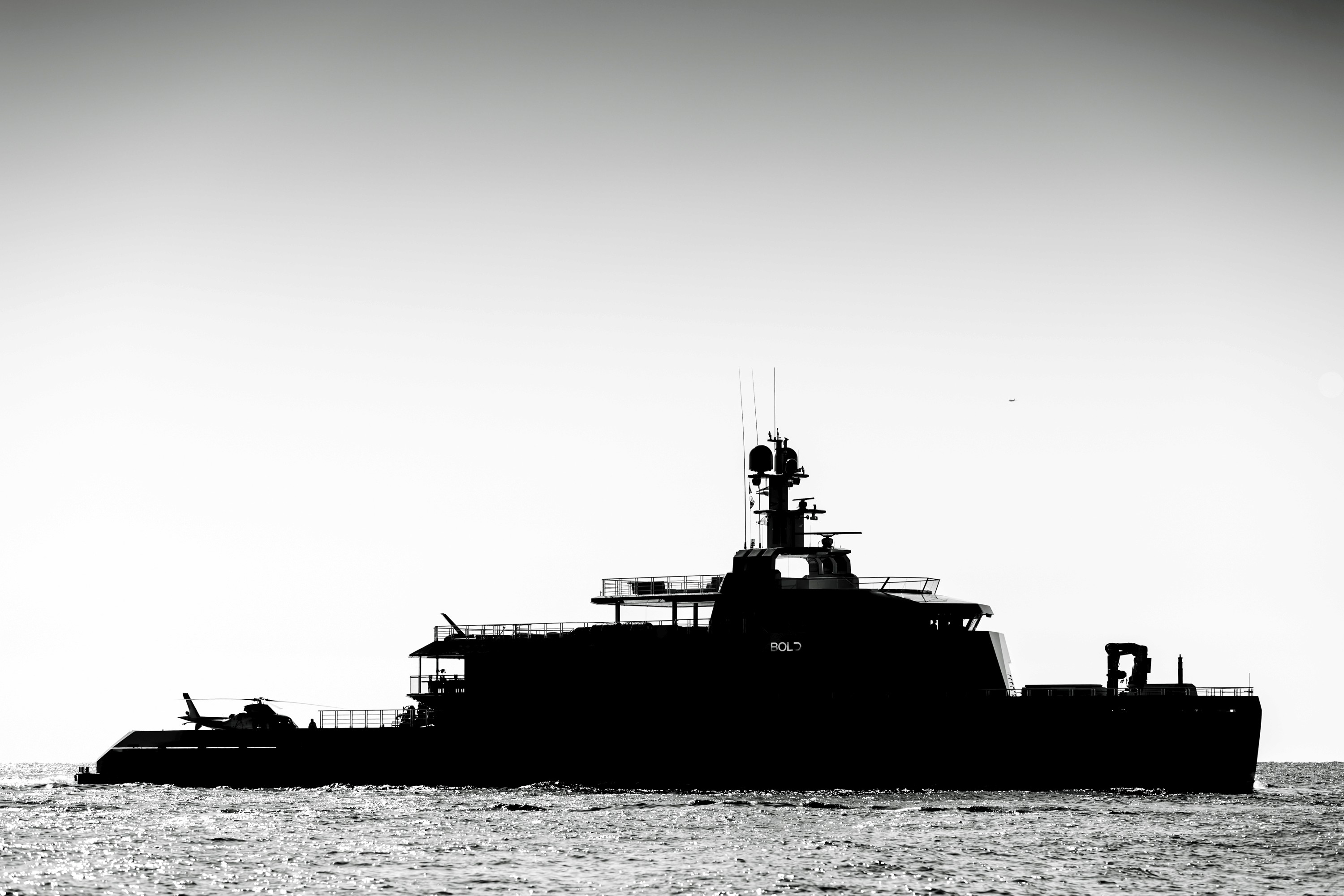 Warm minimalist café with curved walls and stools.