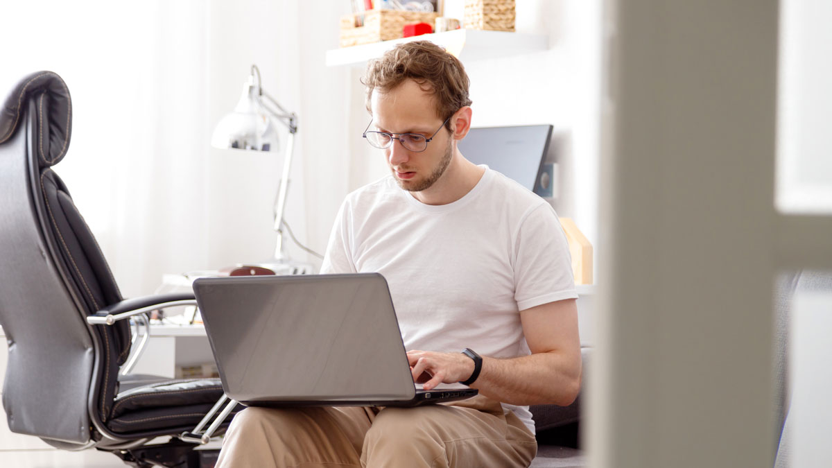 A business owner during a coaching call at his home office