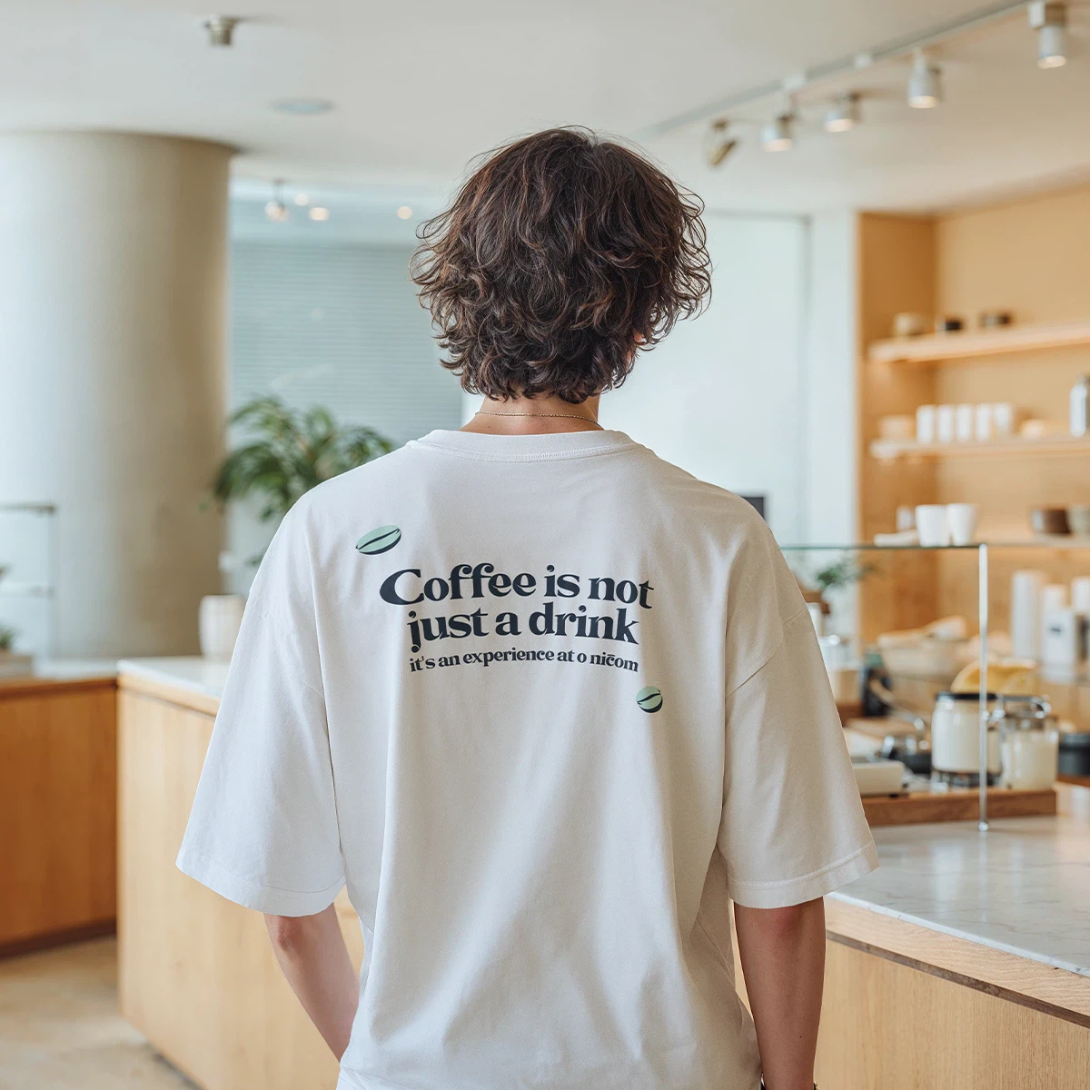 Stacked O nicom coffee cups with coffee beans on a blue background with wavy light design elements.