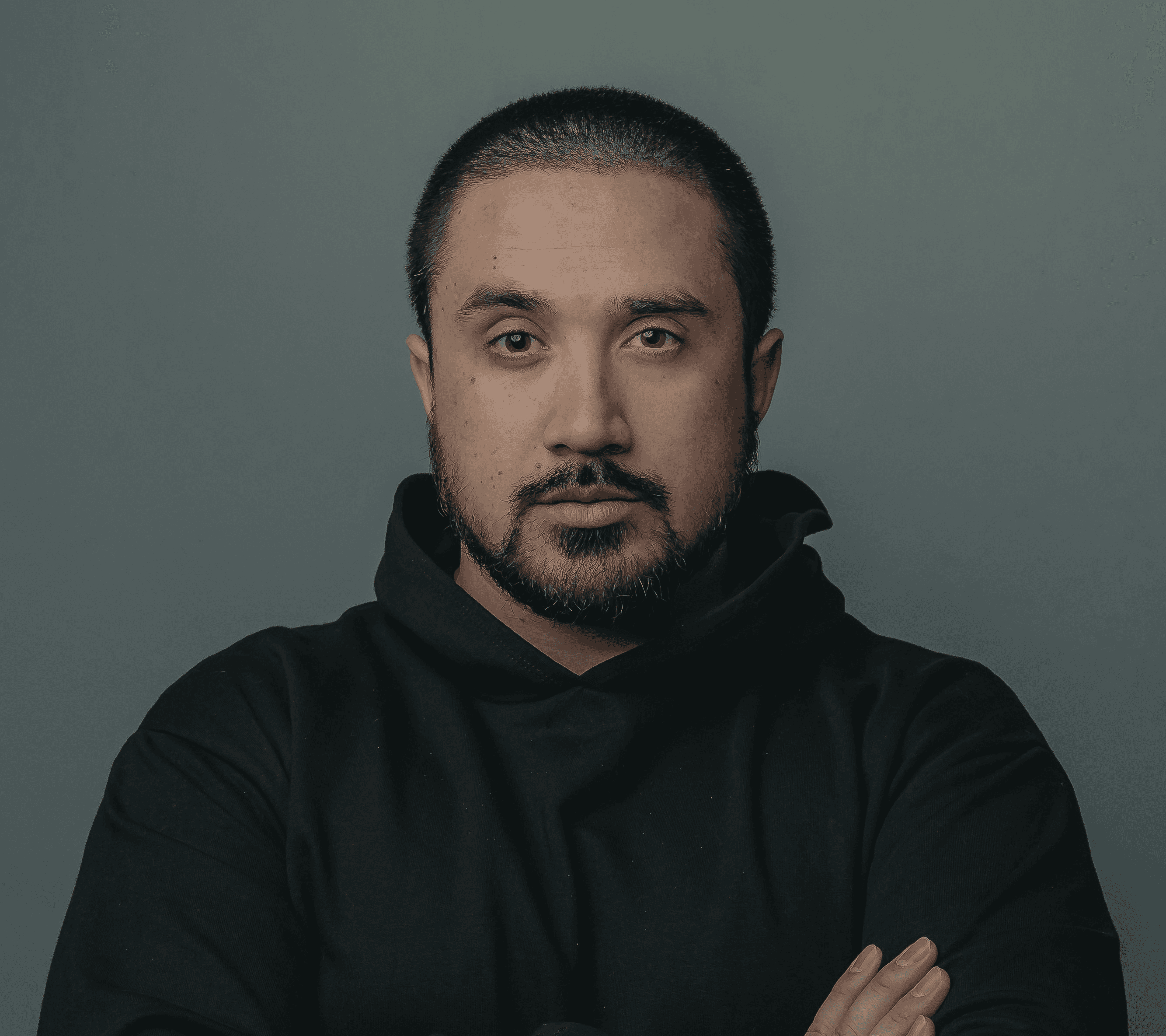 man in black hoodie standing