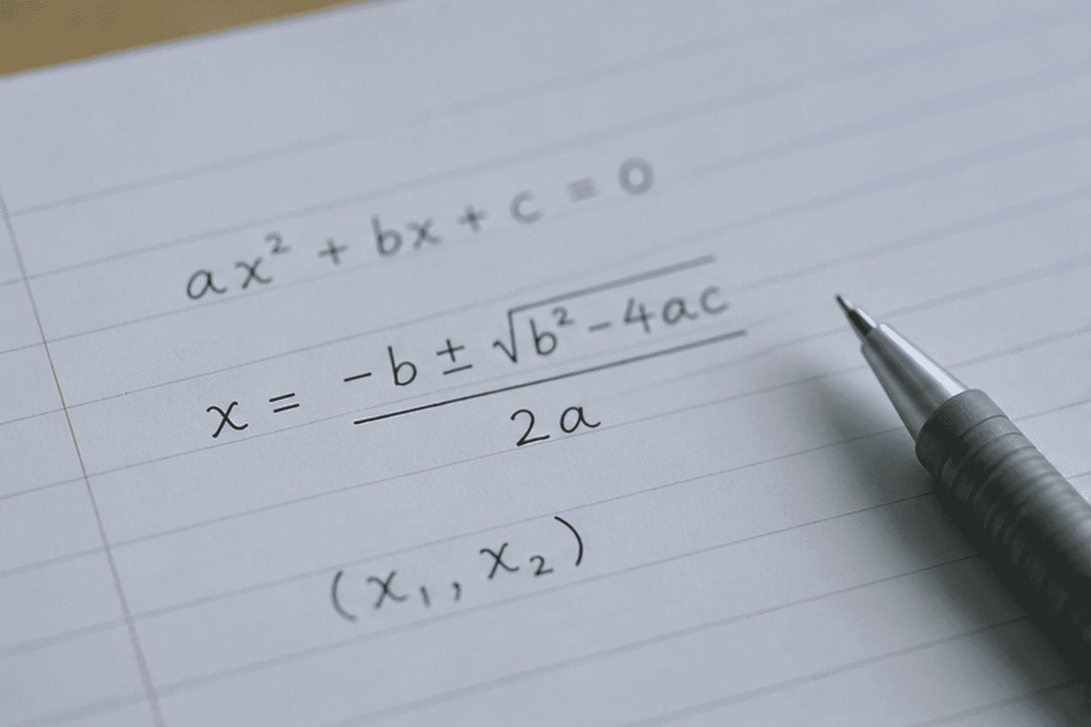 person writing on white paper