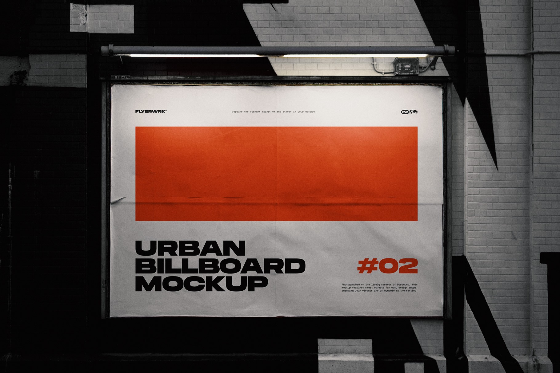 Urban billboard mockup on city wall under dramatic night lighting