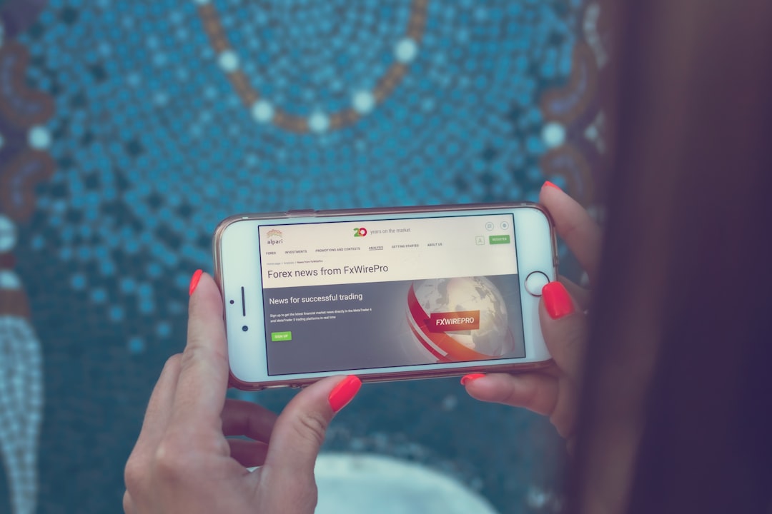 person using silver iPhone 6