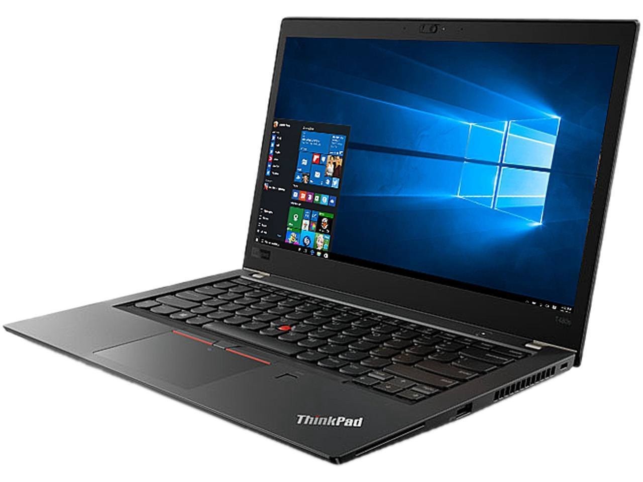 A precise overhead view of a robust, black, corporate Lenovo ThinkPad laptop, open on a pure white background. The screen is bright and clearly shows the Windows 11 desktop with its signature blue abstract wallpaper and open information windows. The full QWERTY keyboard is visible, highlighting the unique red TrackPoint pointing stick at the center. The trackpad features dedicated red-striped click buttons. The specific 'ThinkPad' logo is visible on the bottom right of the palm rest. This image shows the durable, affordable off-lease alternative discussed in the guide.