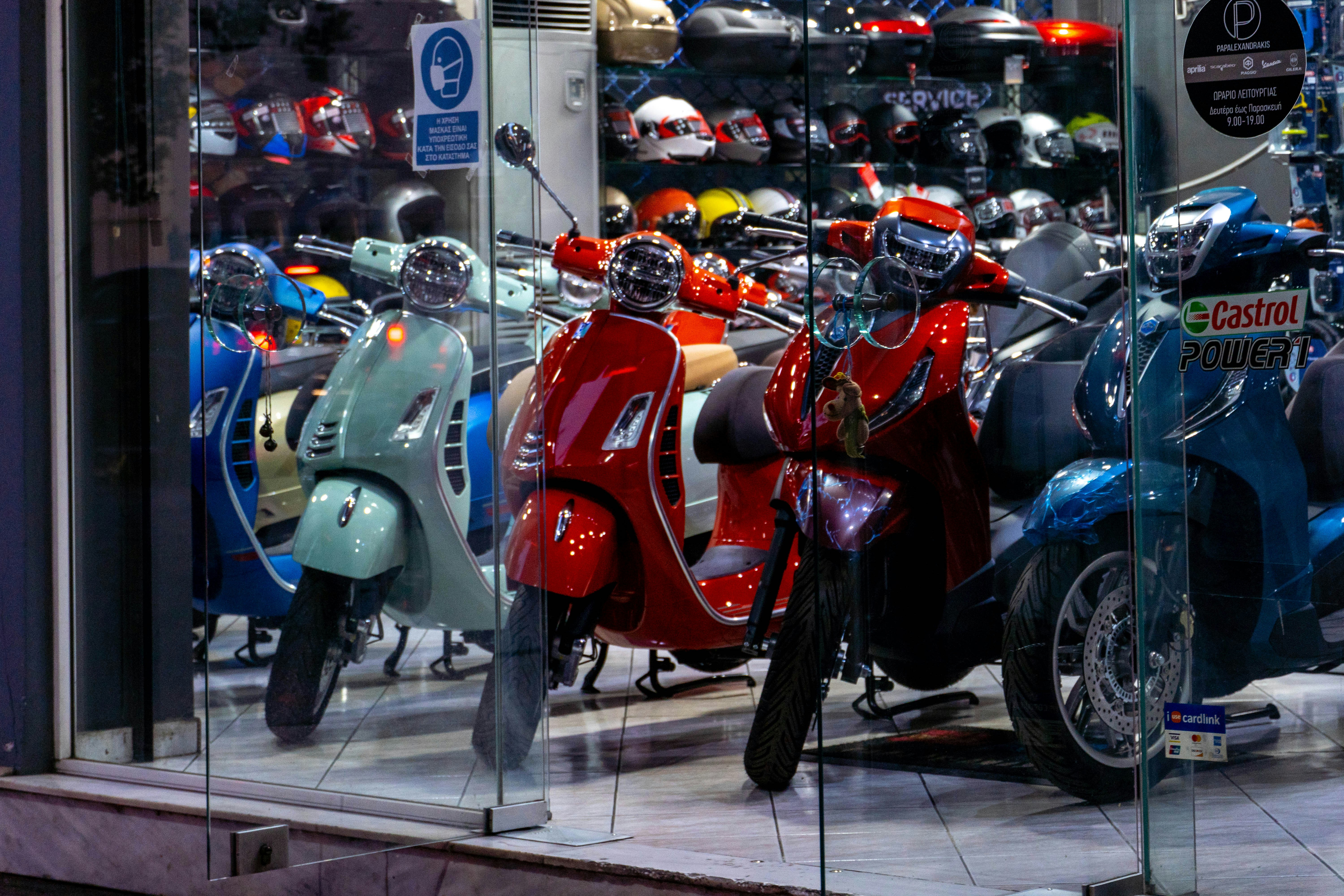 a group of motor scooters parked next to each other