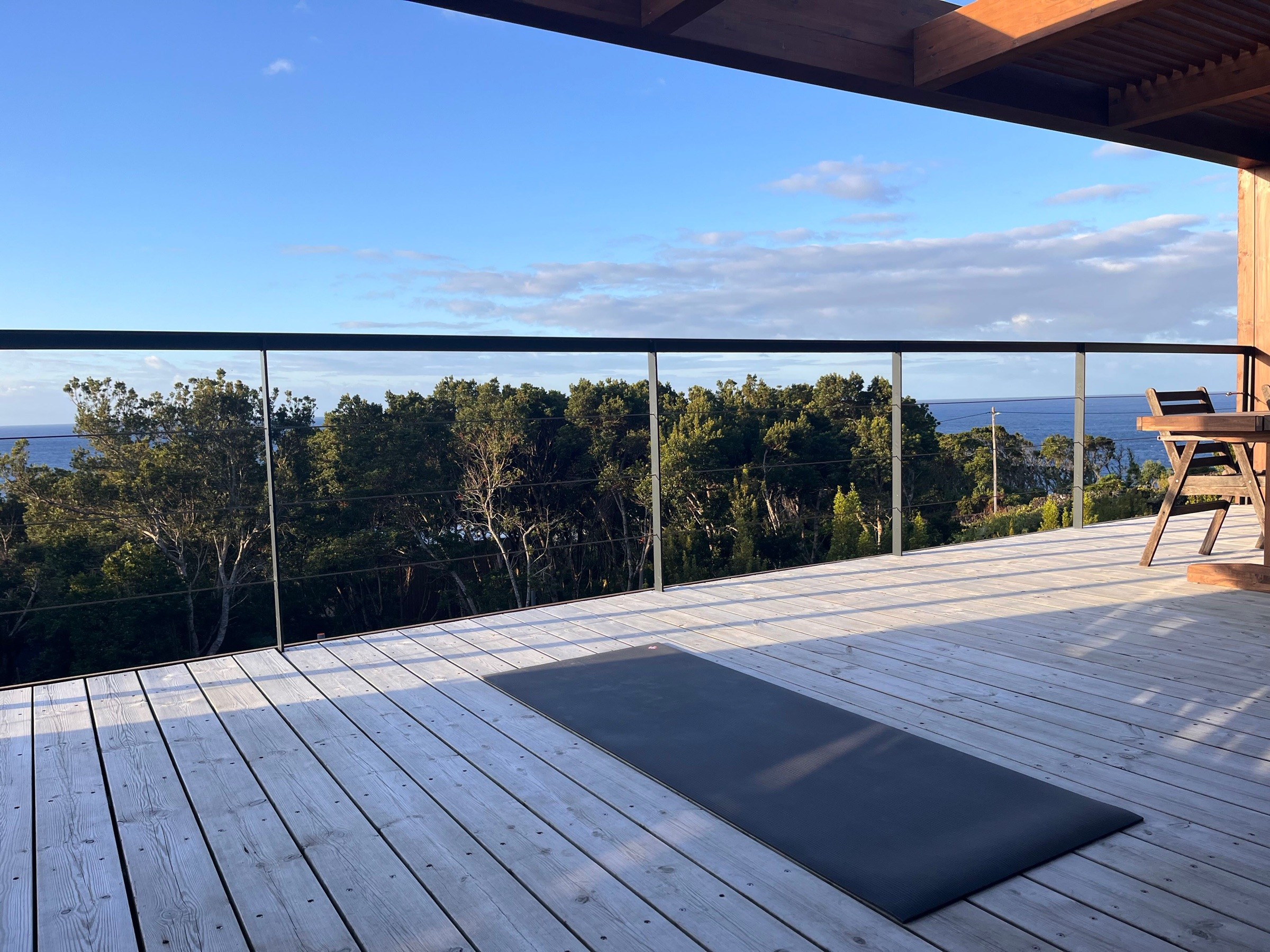 Yoga mat placed on the deck of the main house