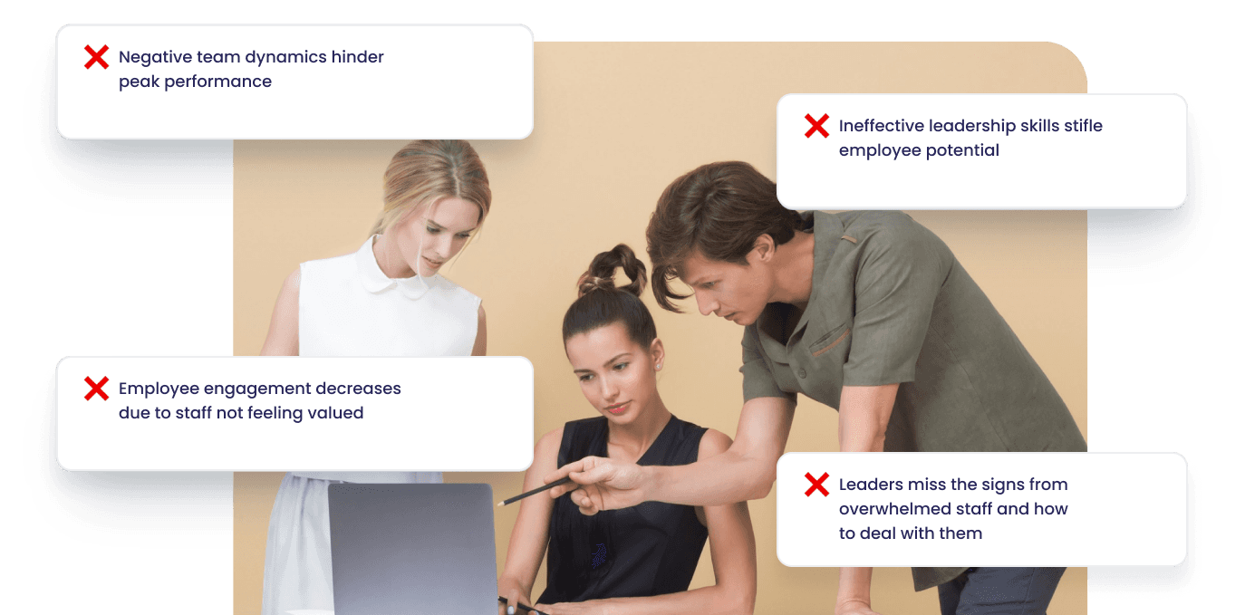 Two people standing next to a laptop and another person touching it.