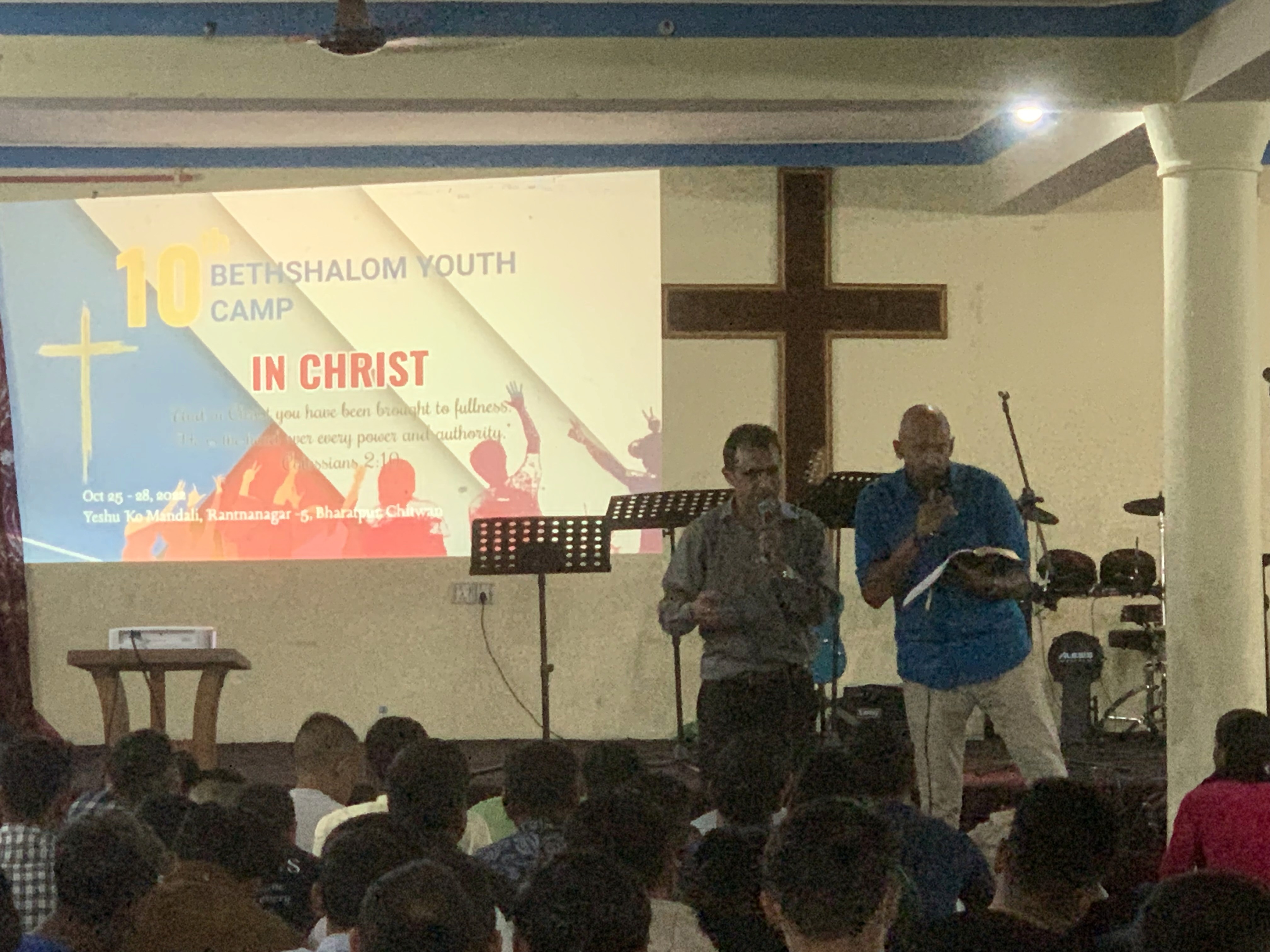 the interior of a church with pews and a gold alter