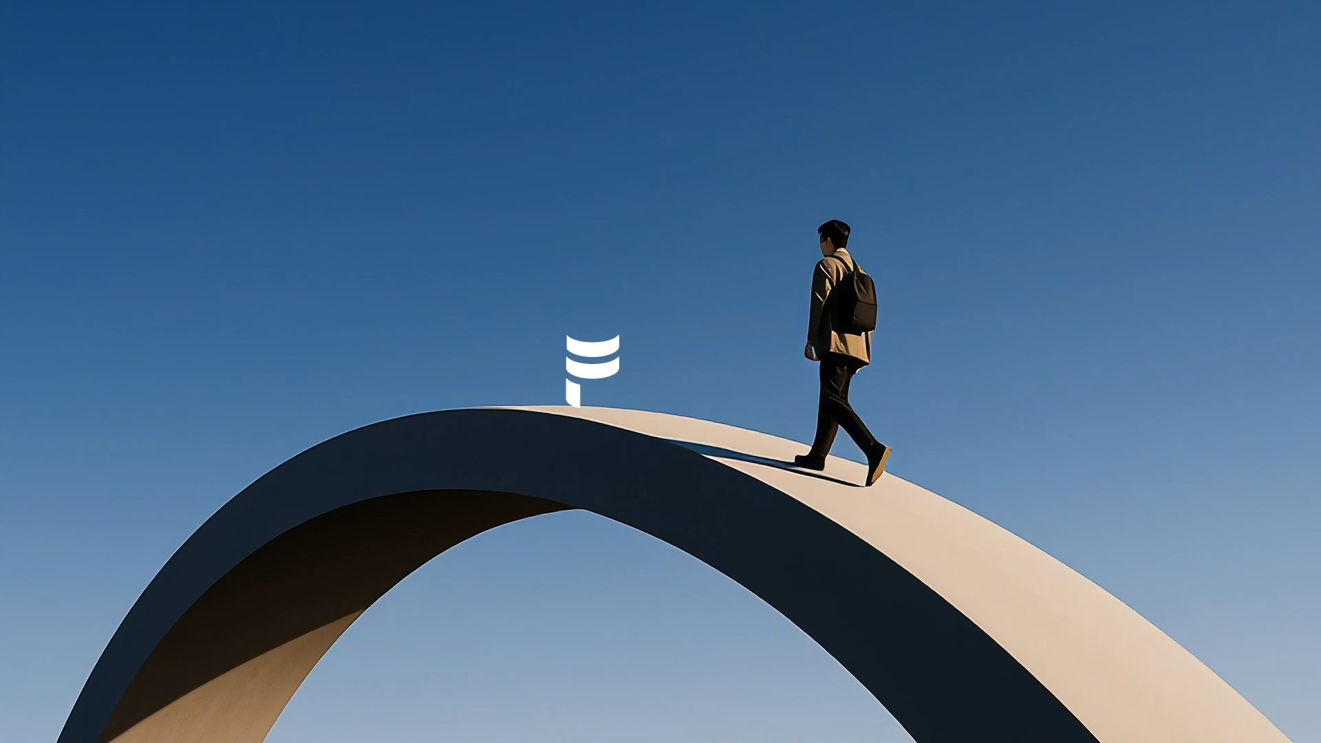person walking over the bridge and the F logo in the middle