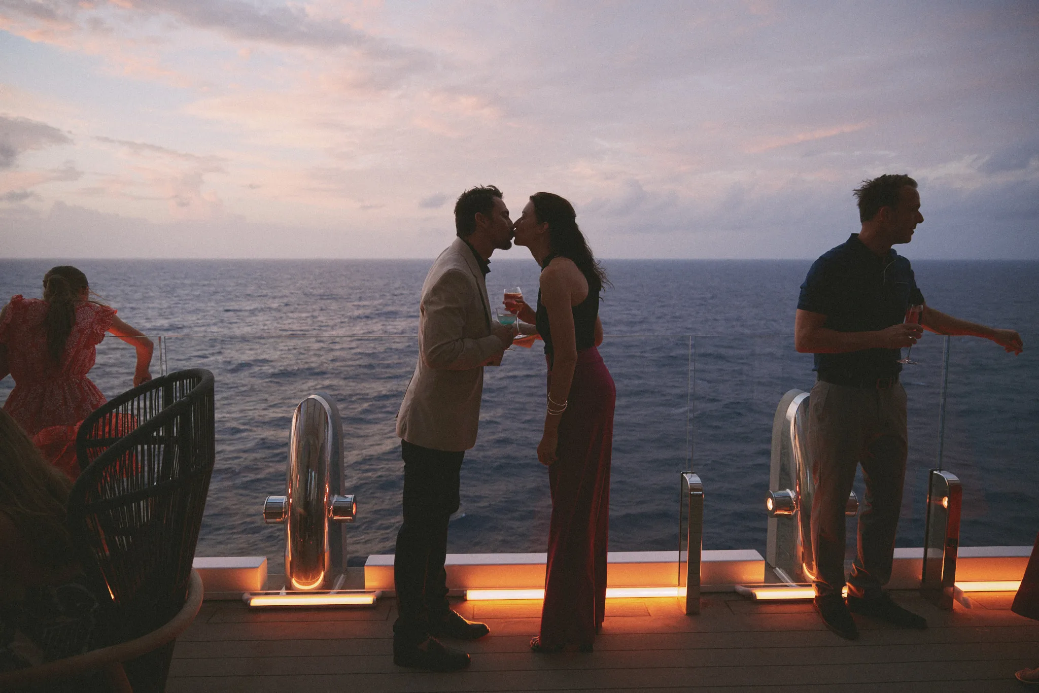 kiss at the ships railing — lifestyle photography by Tom Kubik