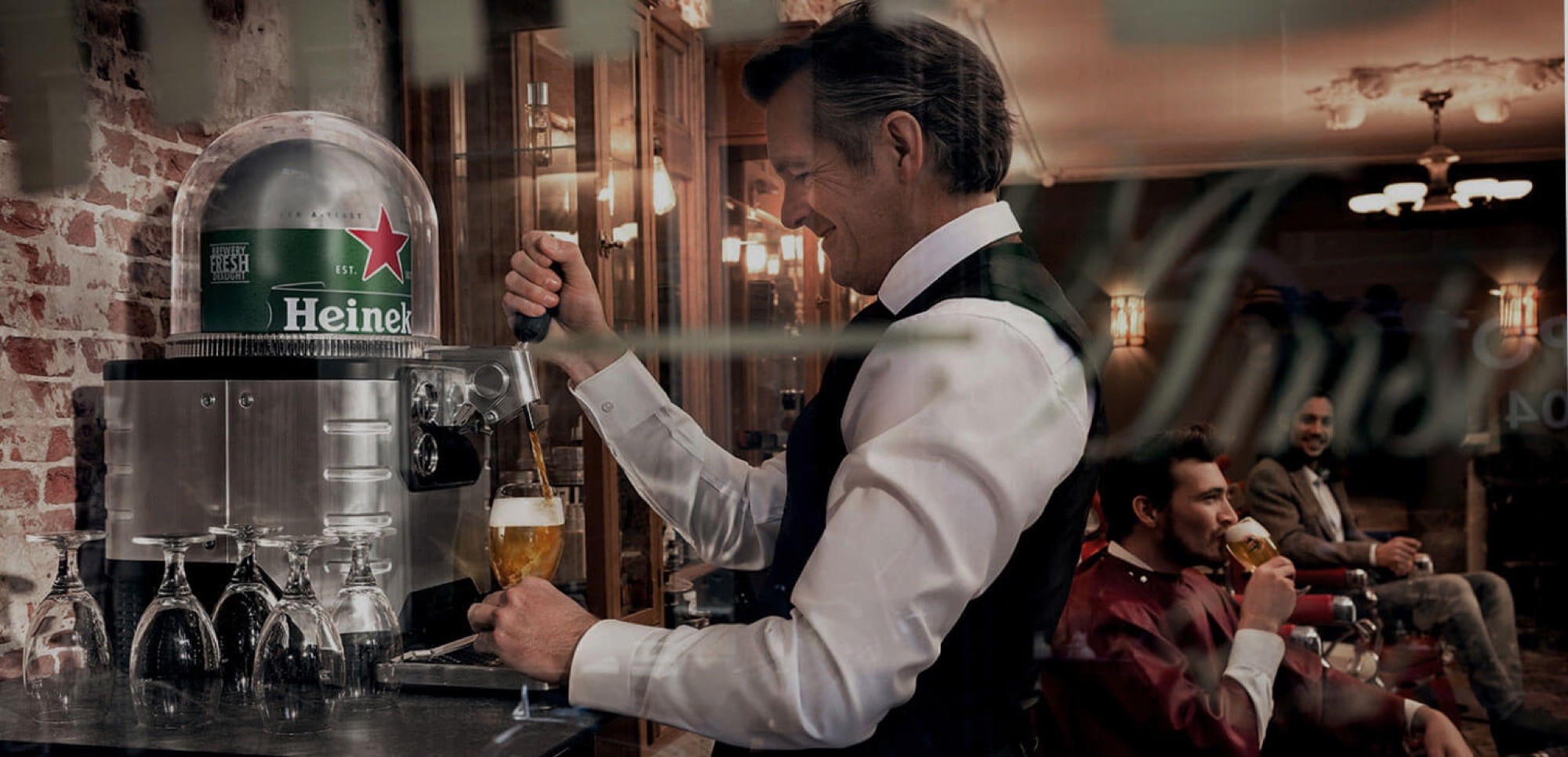 Pouring a Heineken at the bar