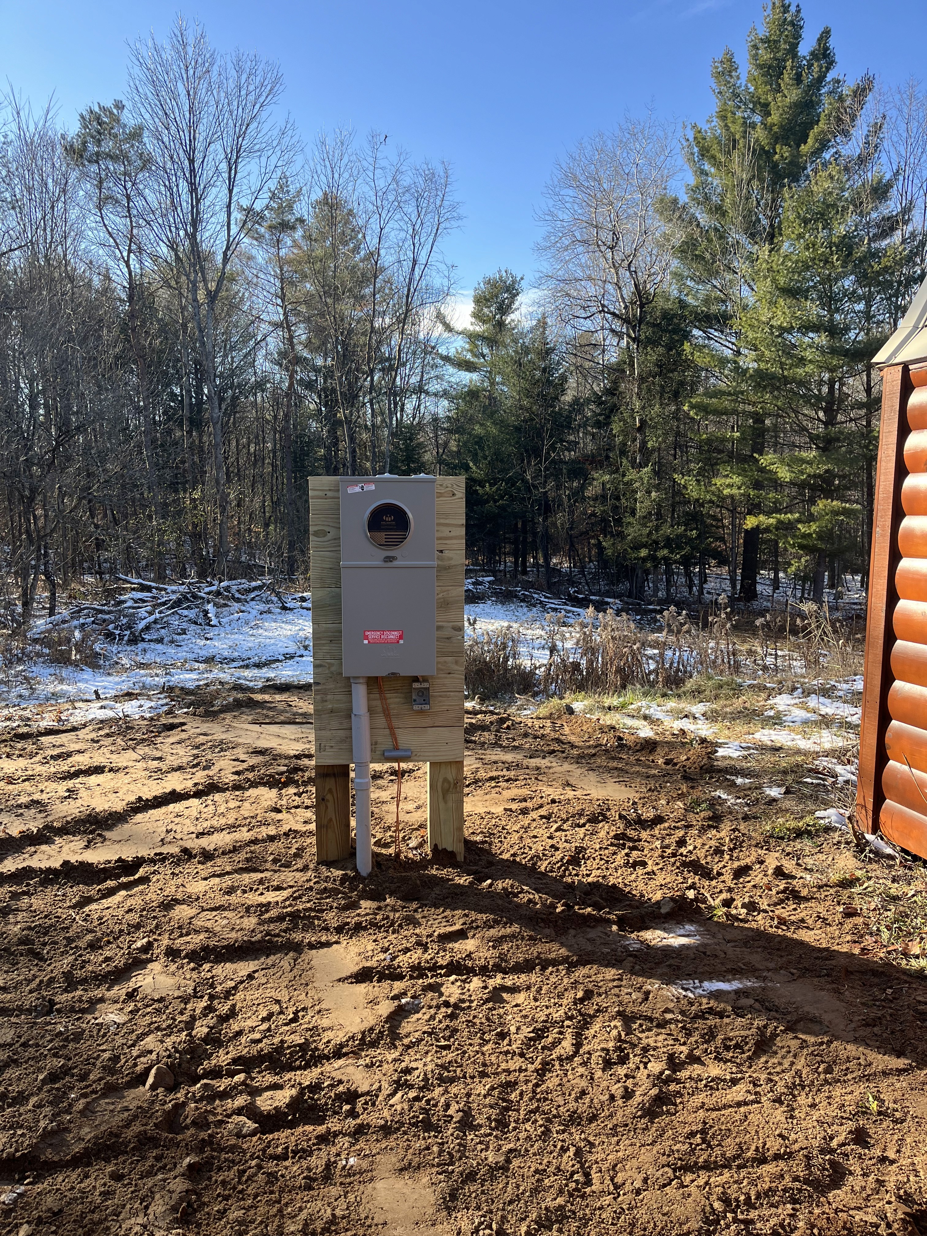 man in brown hat holding black and gray power tool