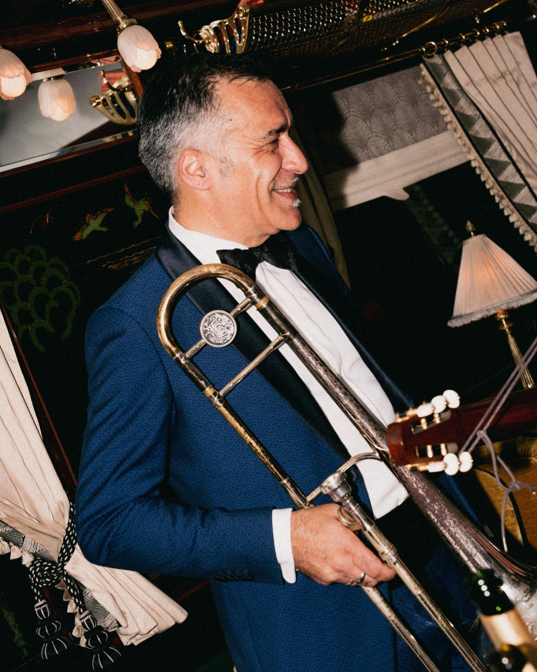 two people looking at a tablet and smiling