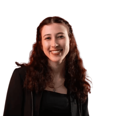 man sitting facing silver MacBook inside room