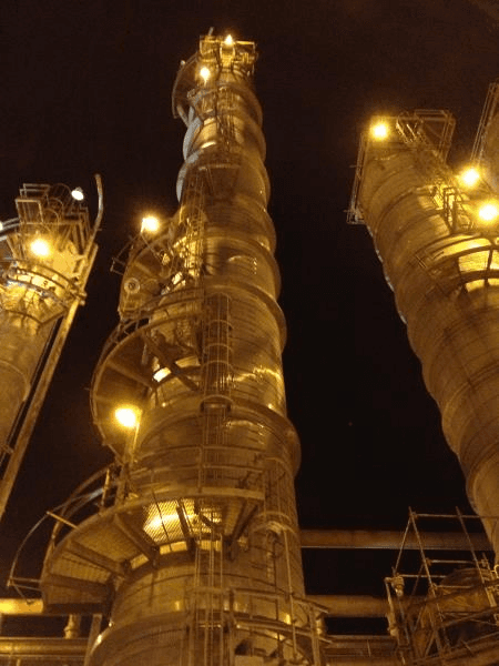 Integrated process system with valves, control panels, and flow piping inside a facility