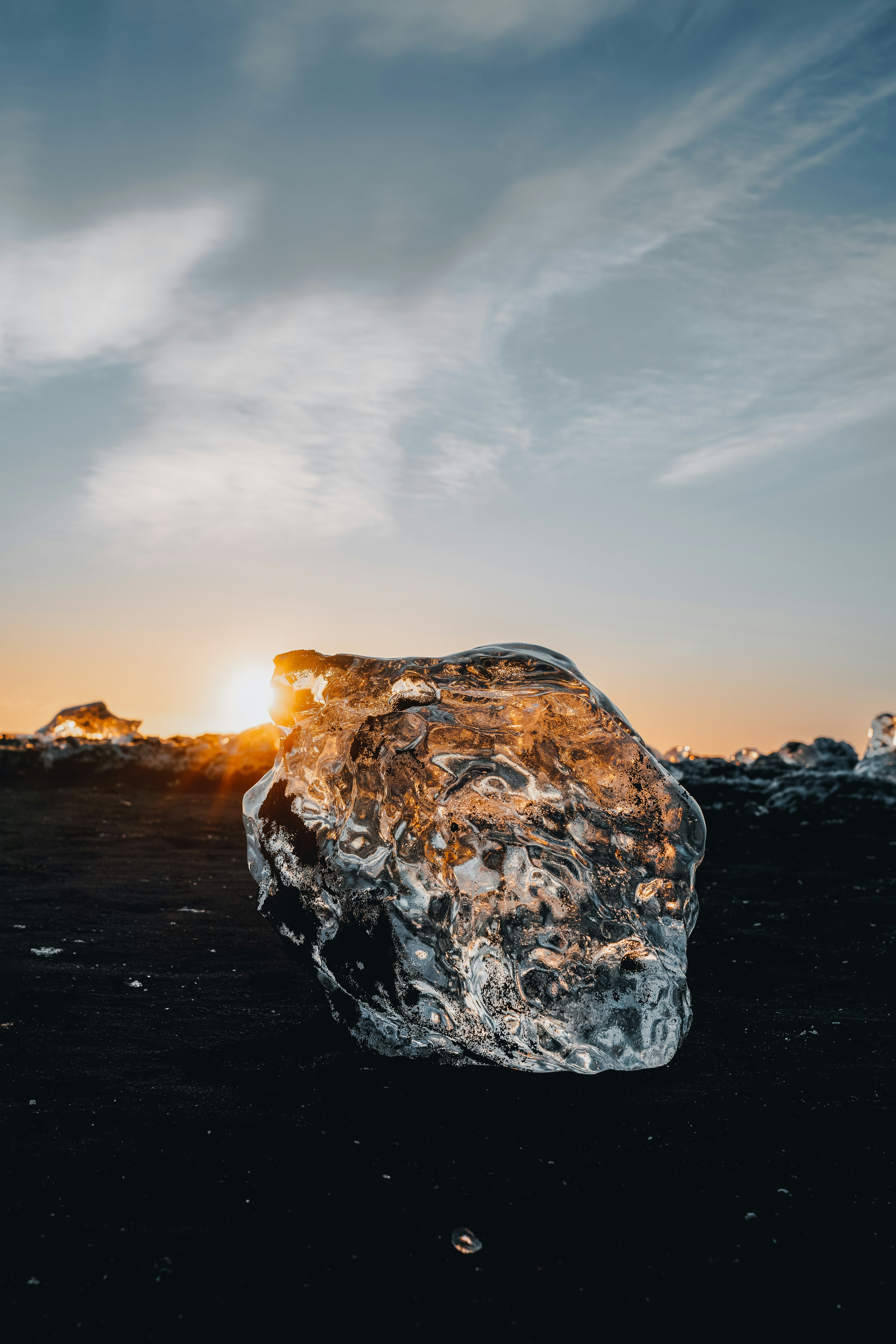 a large ice block sitting on top of a beach