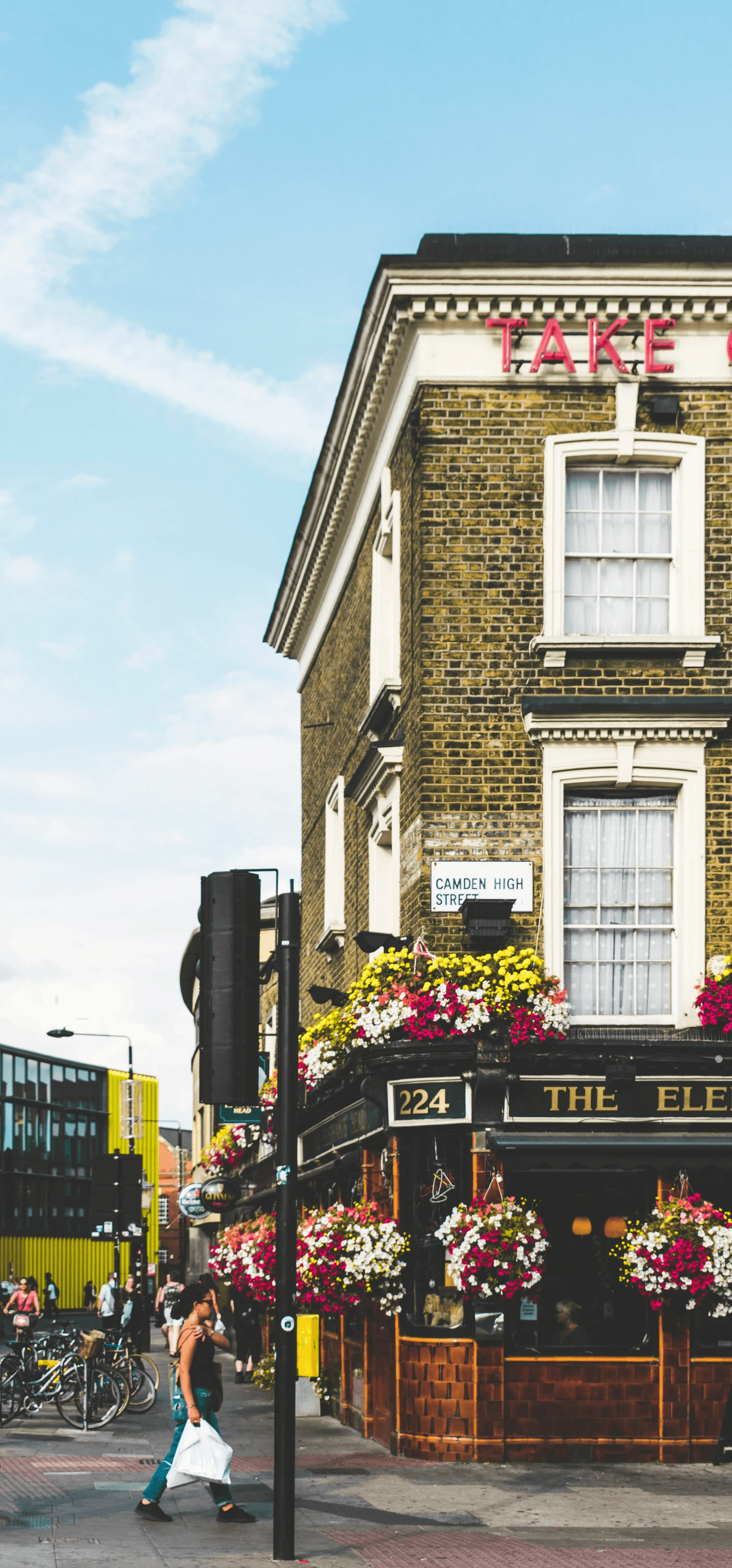 girl walking past london pub