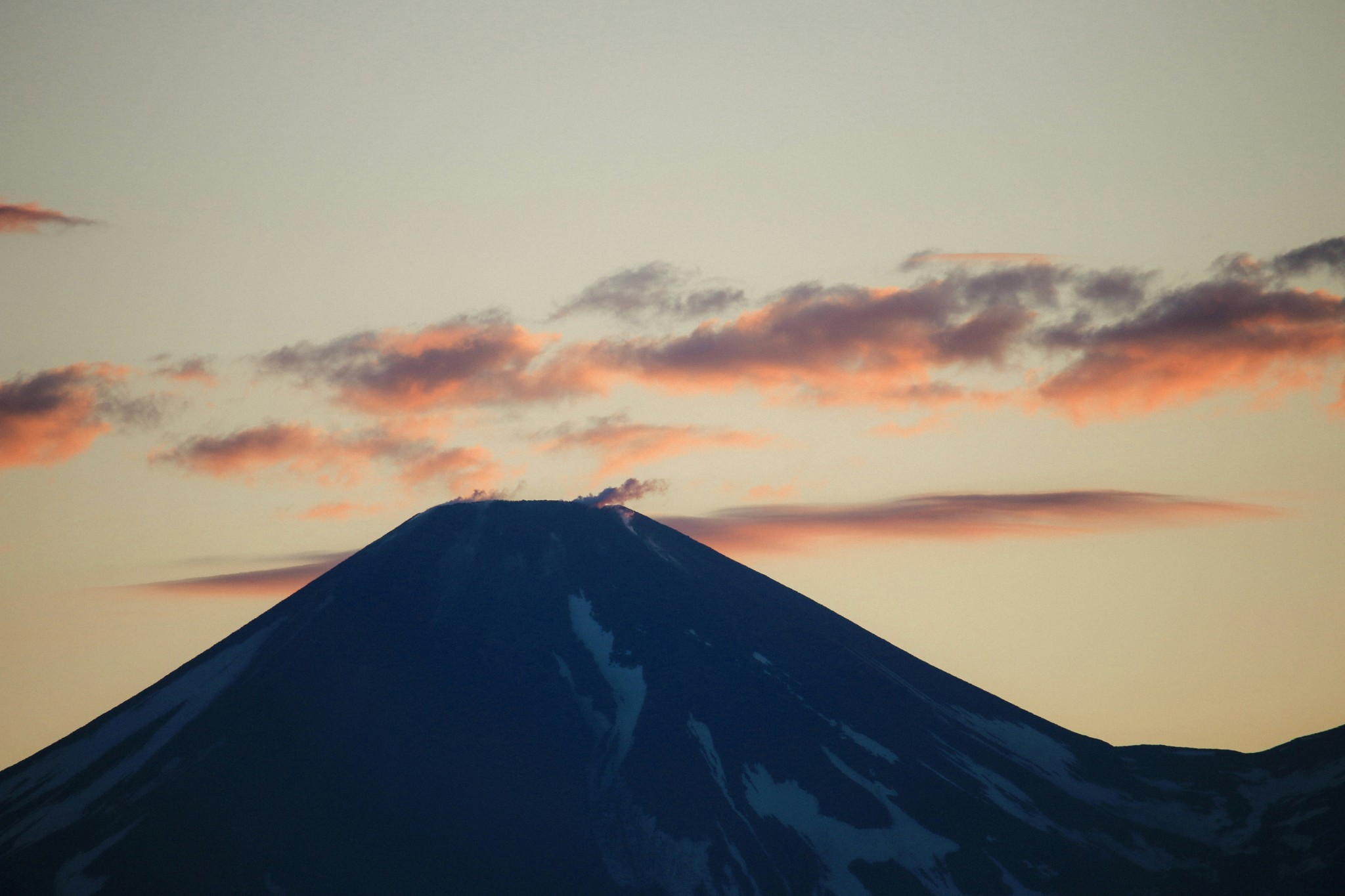 Majestic mountain peak at sunset with clouds