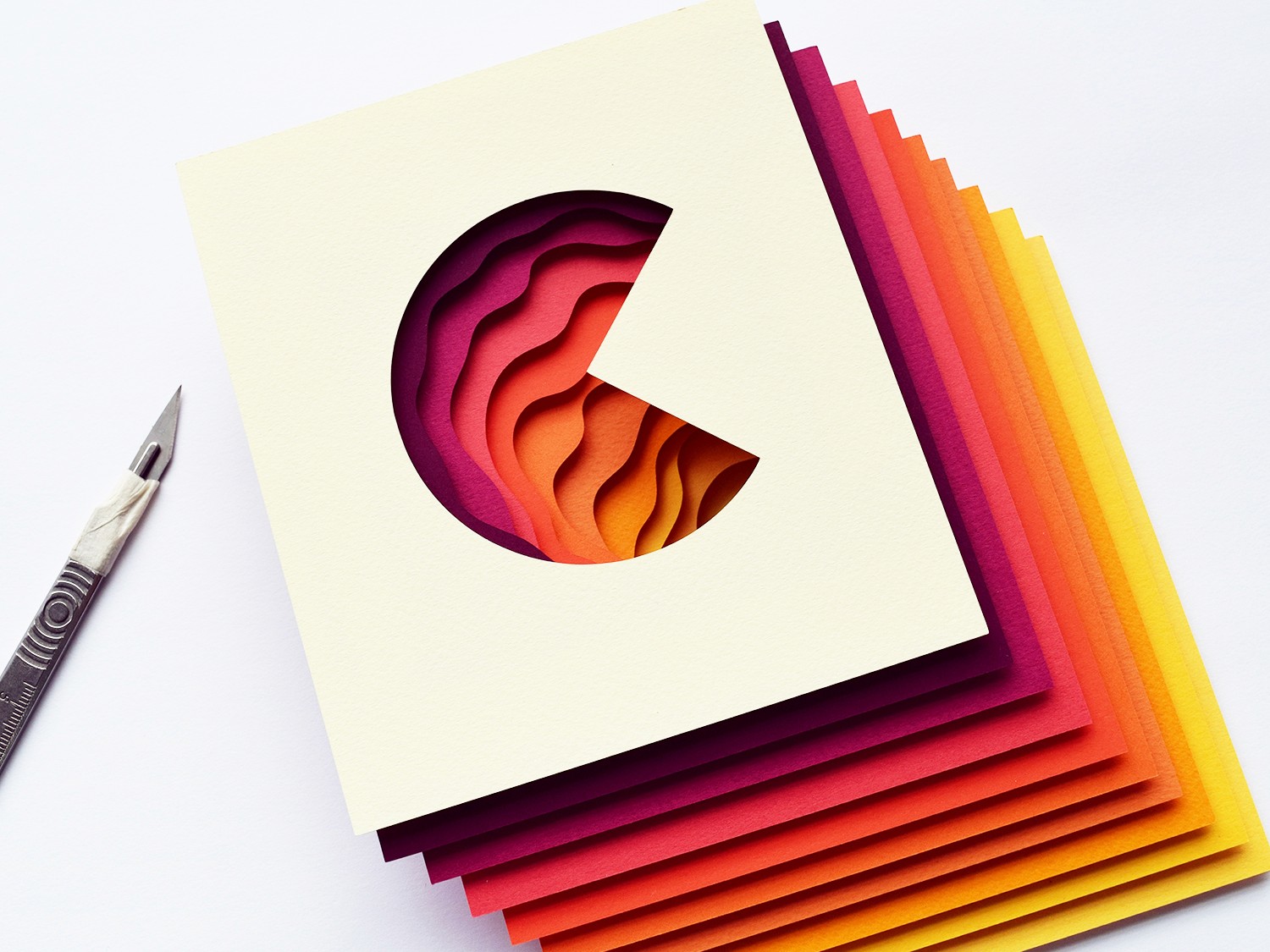 Multicolored hand-cut artwork representing the "C" in California