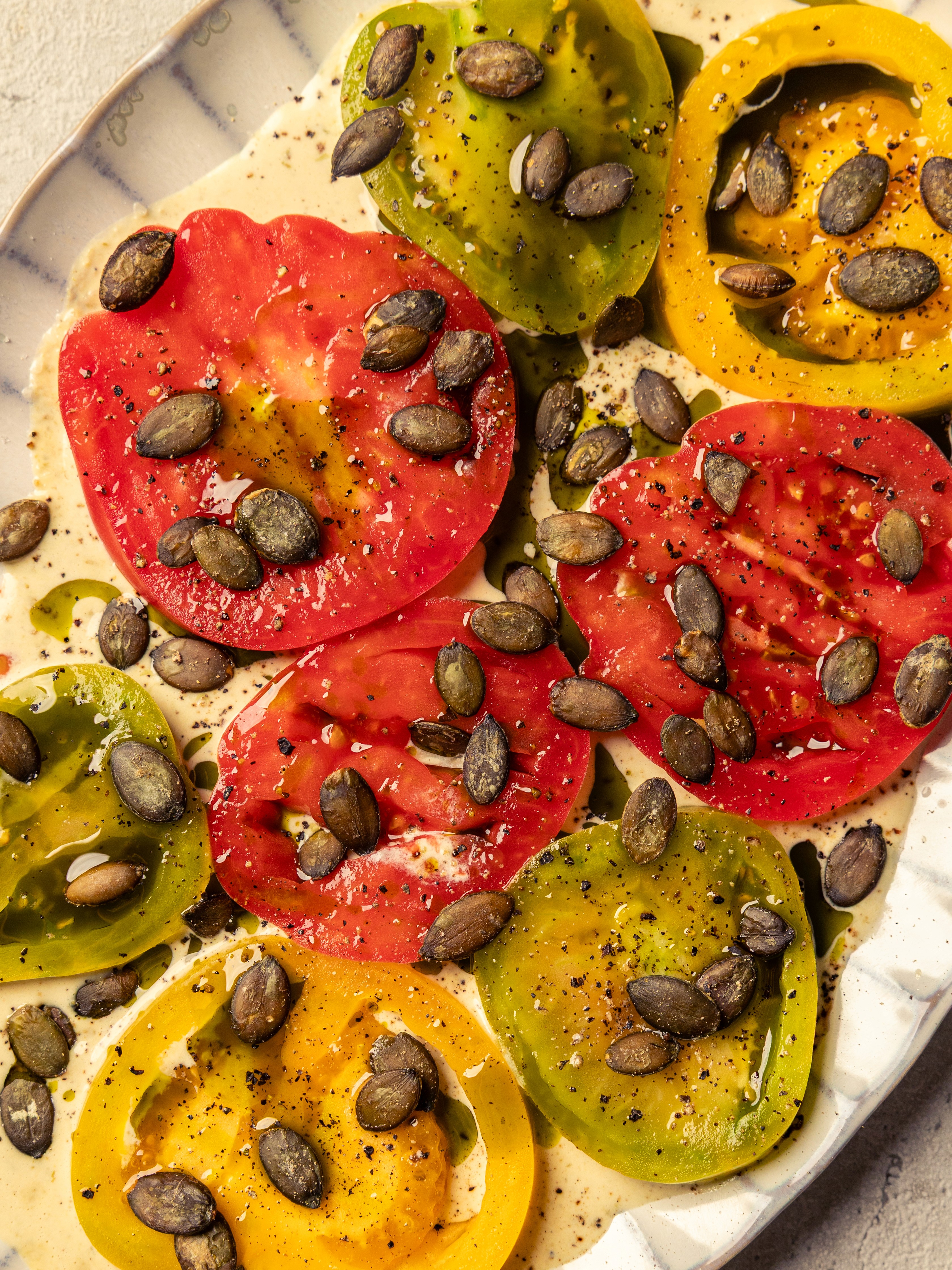 Tomato and Pumpkin seed salad on Tahini sauce