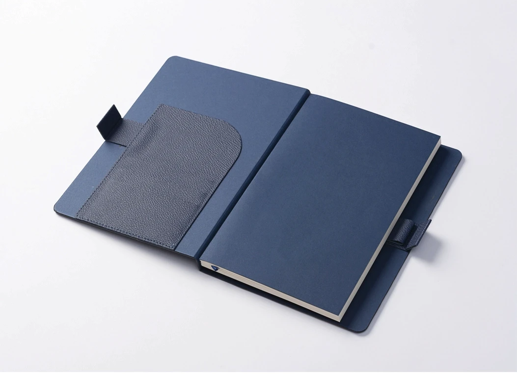 Interior view of leather journal cover with pocket and closure tab