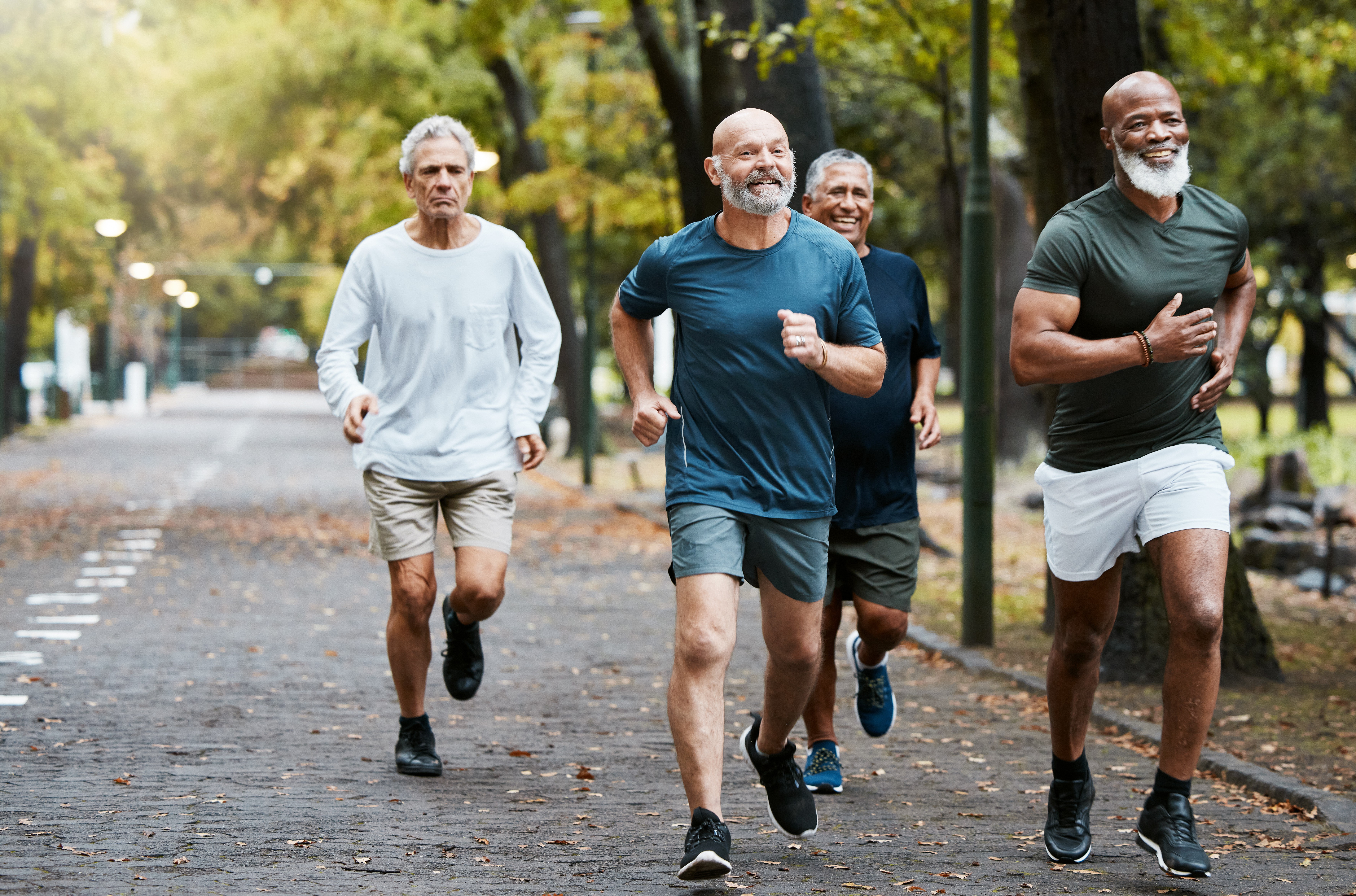 Group of men running together, representing fitness testing and performance assessment.