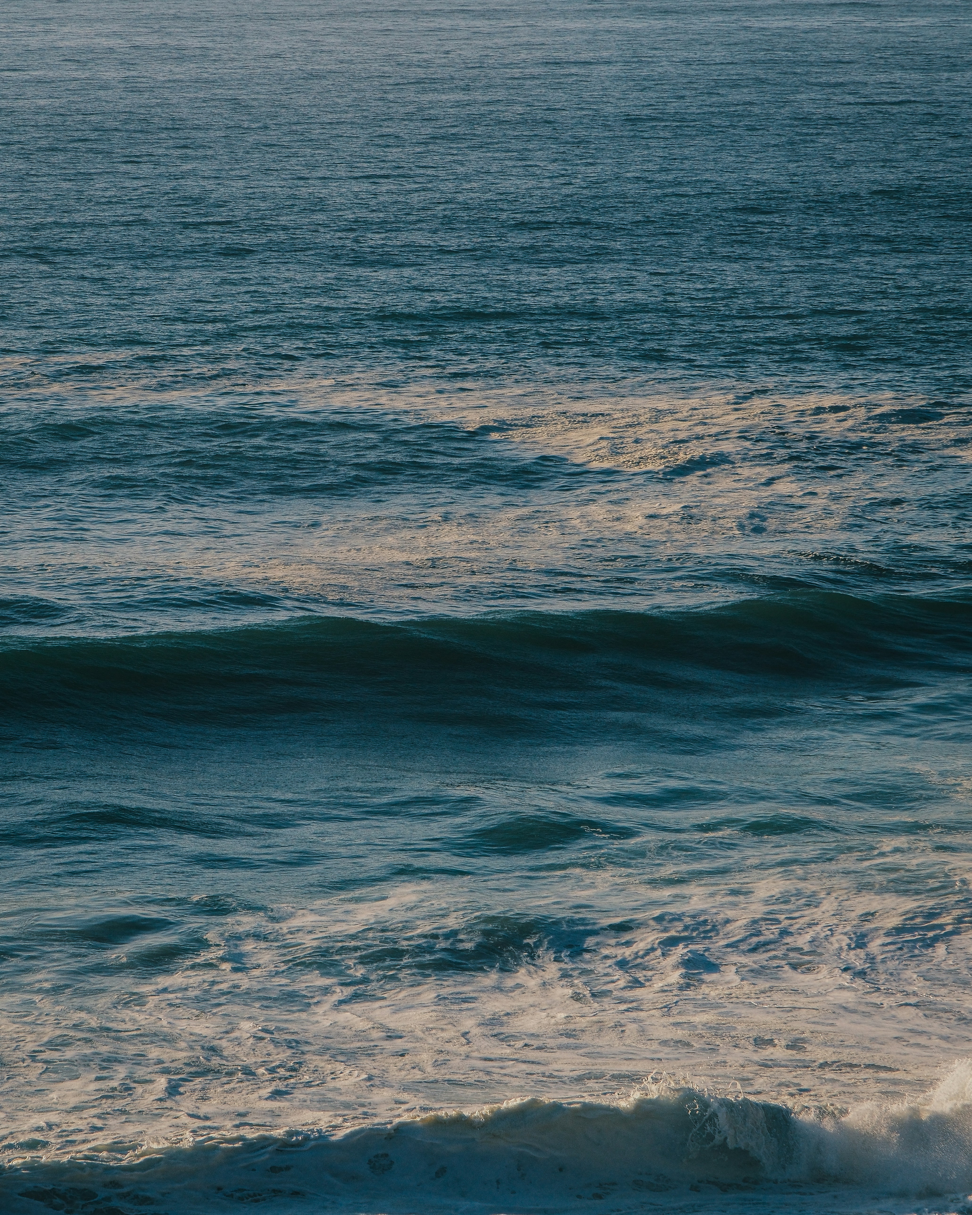 Waves crashing on a deep blue ocean