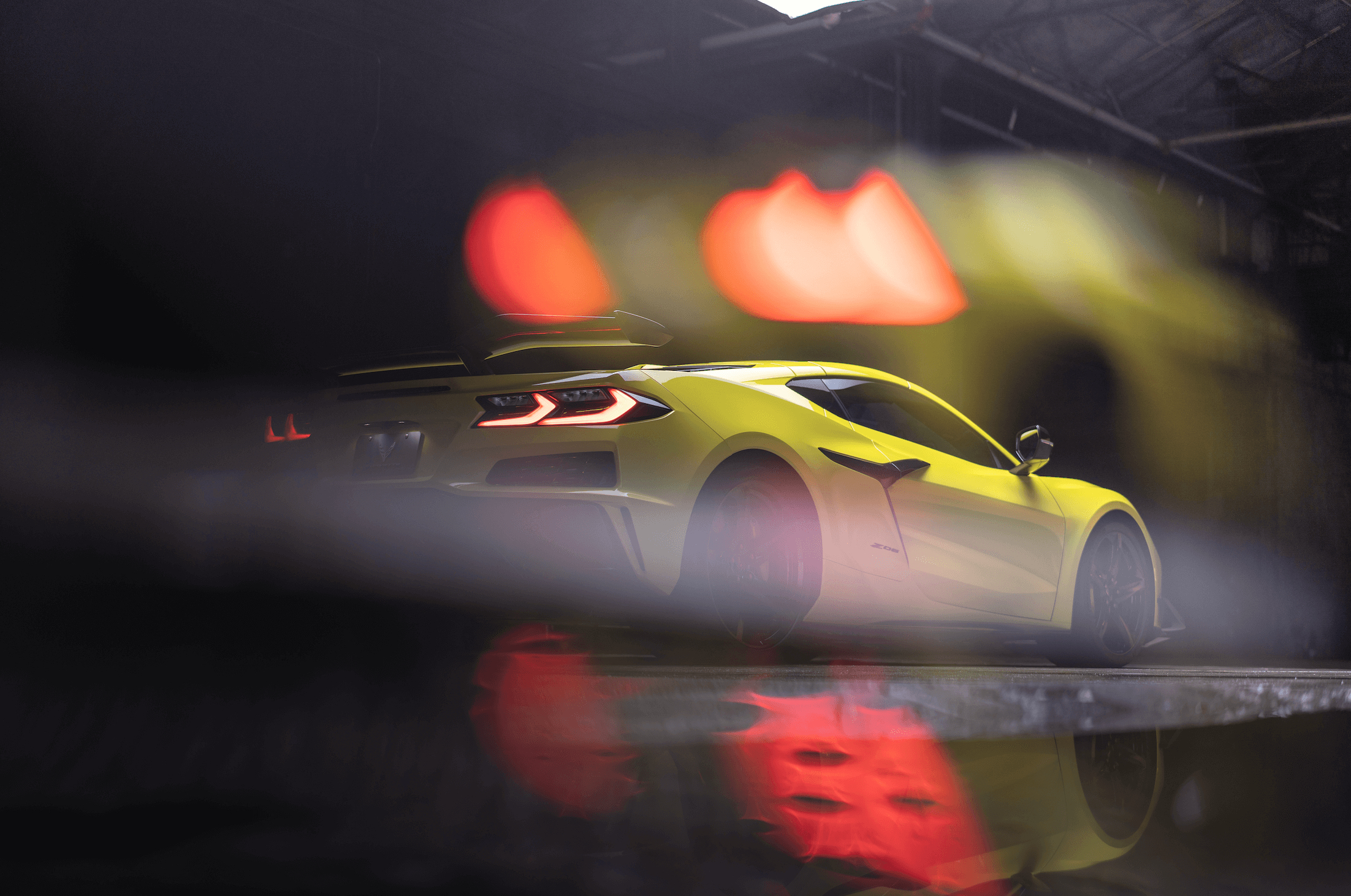 Women drinking from a schweppes bottle laying down on a tennis court
