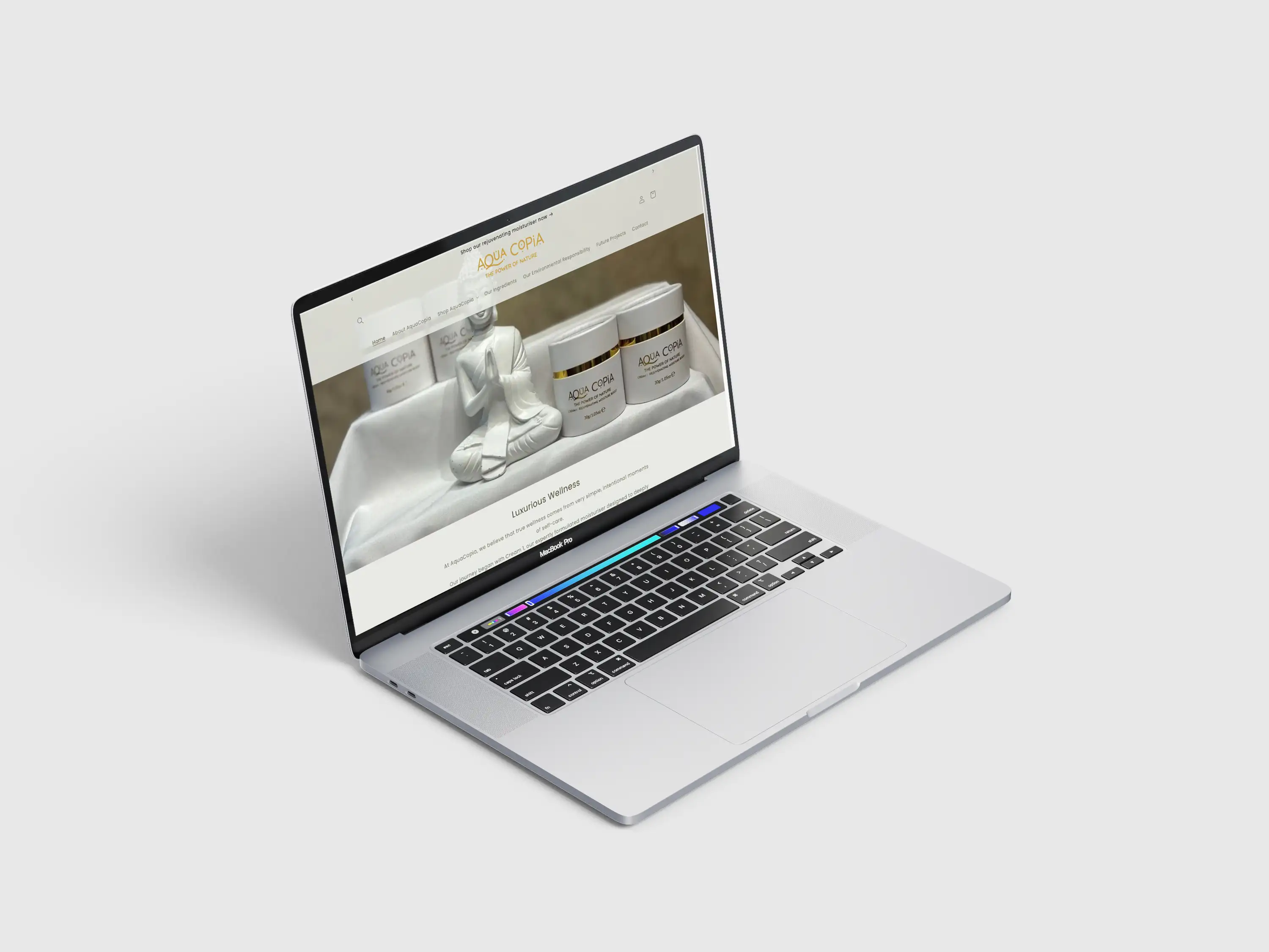 AquaCopia Shopify storefront displayed on a laptop, featuring its skincare and wellness products.