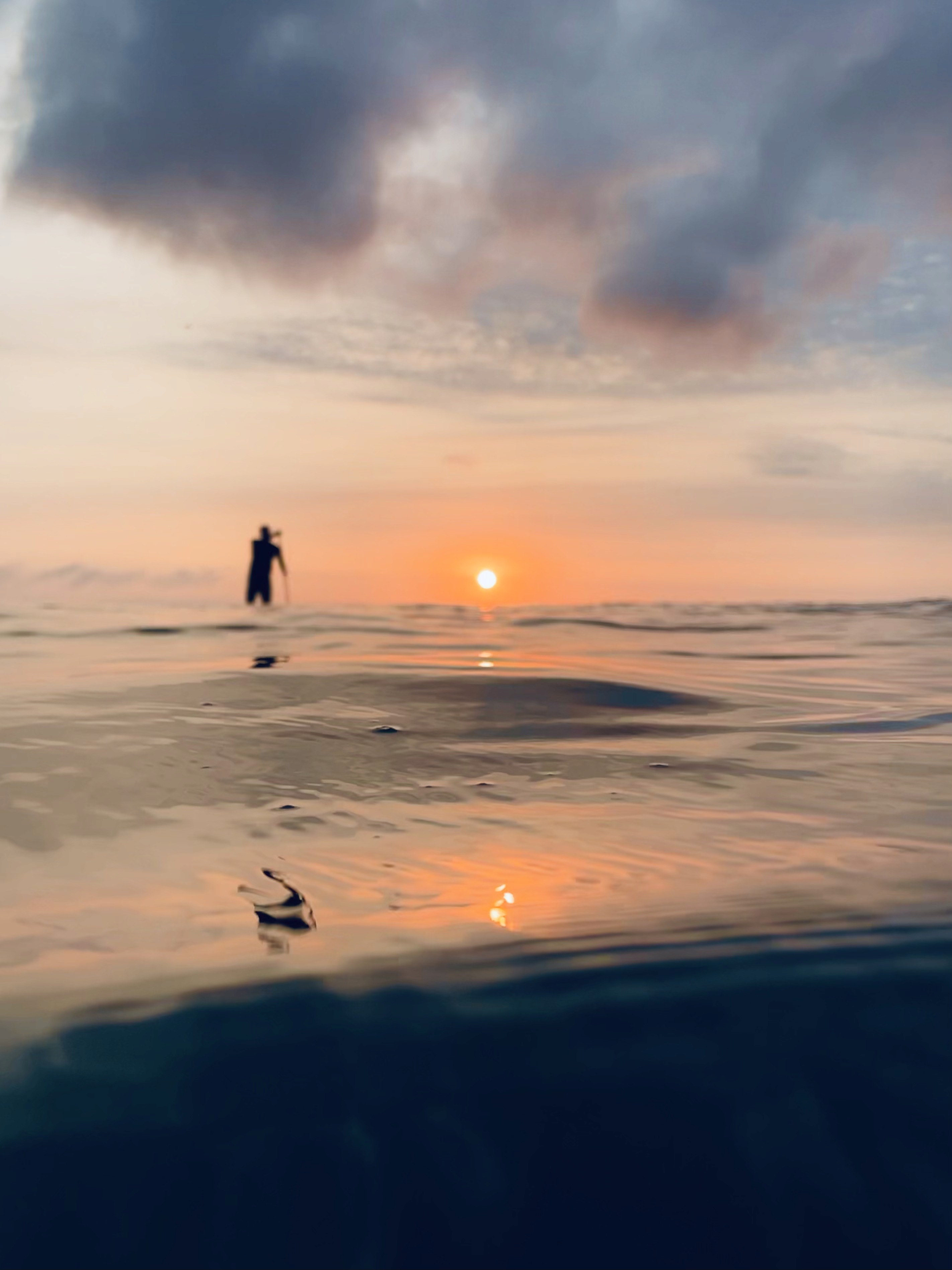 A man with surfboard at beach