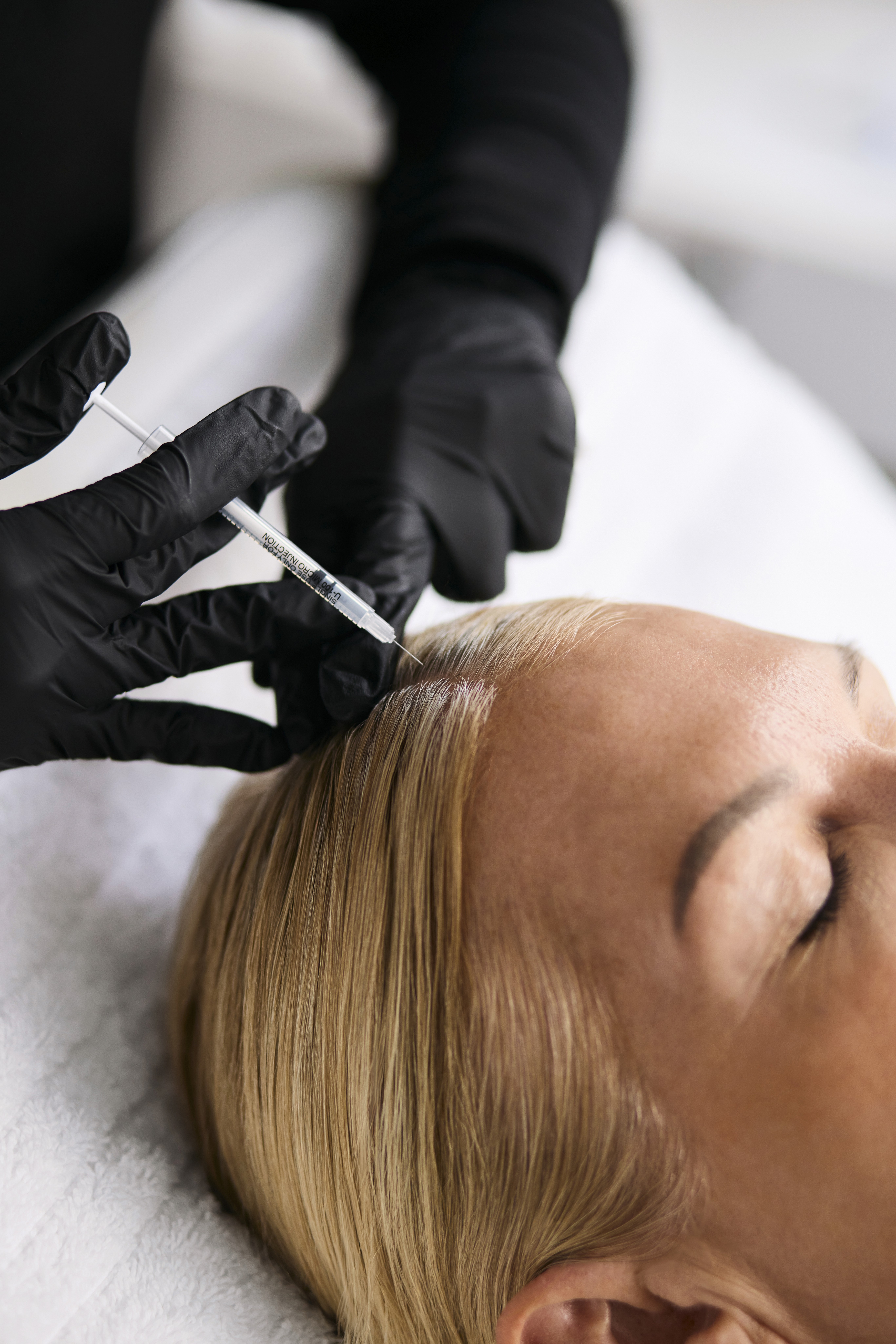 PRP treatment administered by medical professional to man's face for collagen boost and skin rejuvenation