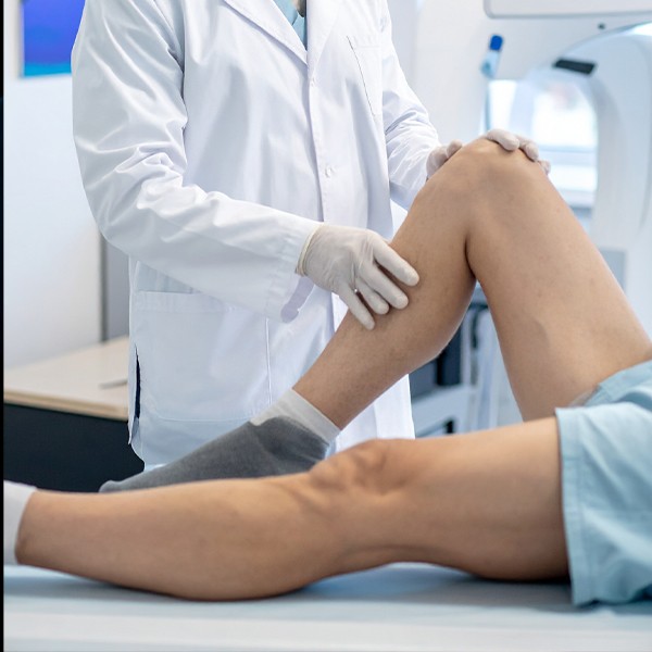 A man holding his leg