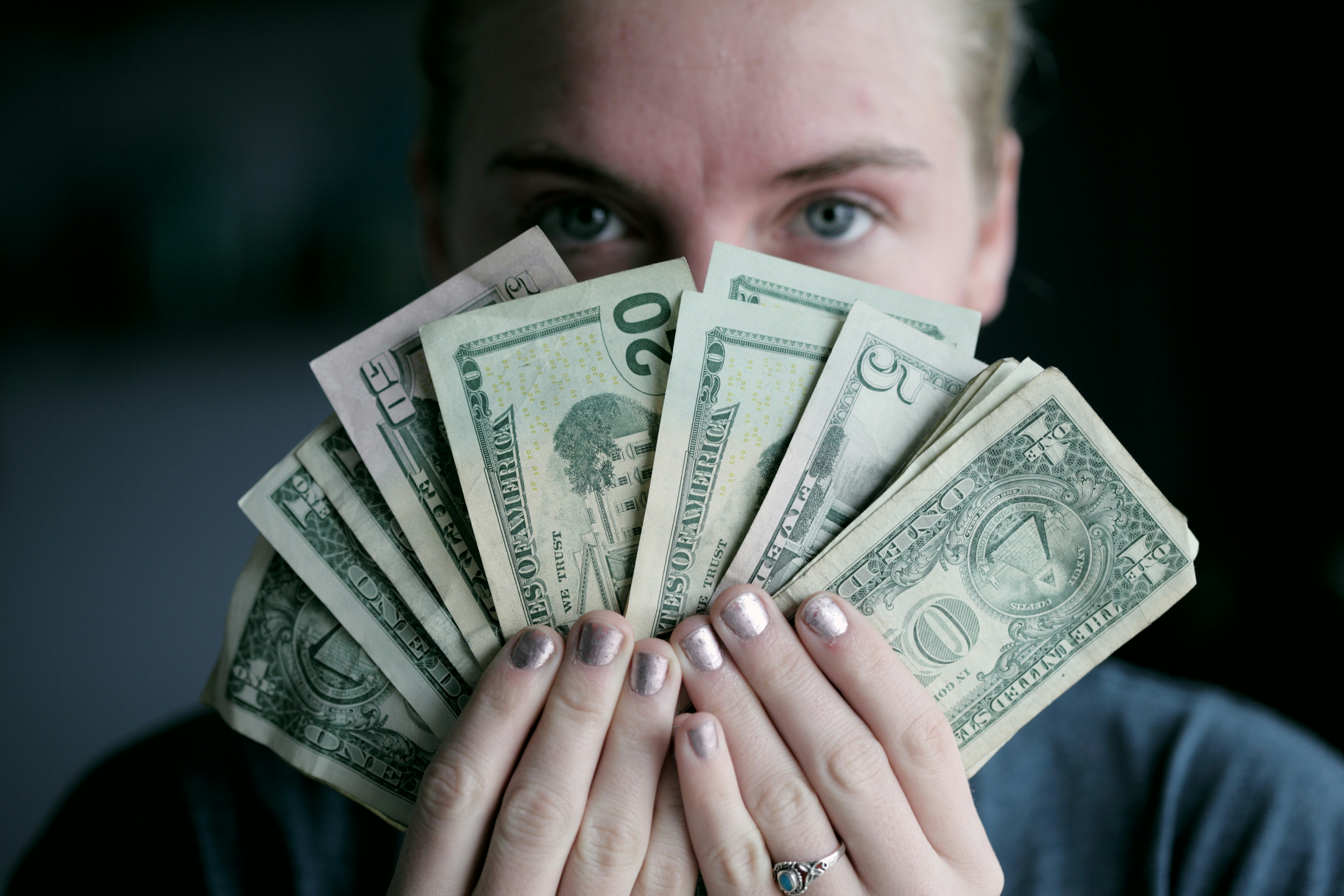 man holding money - Professional Color Analysis