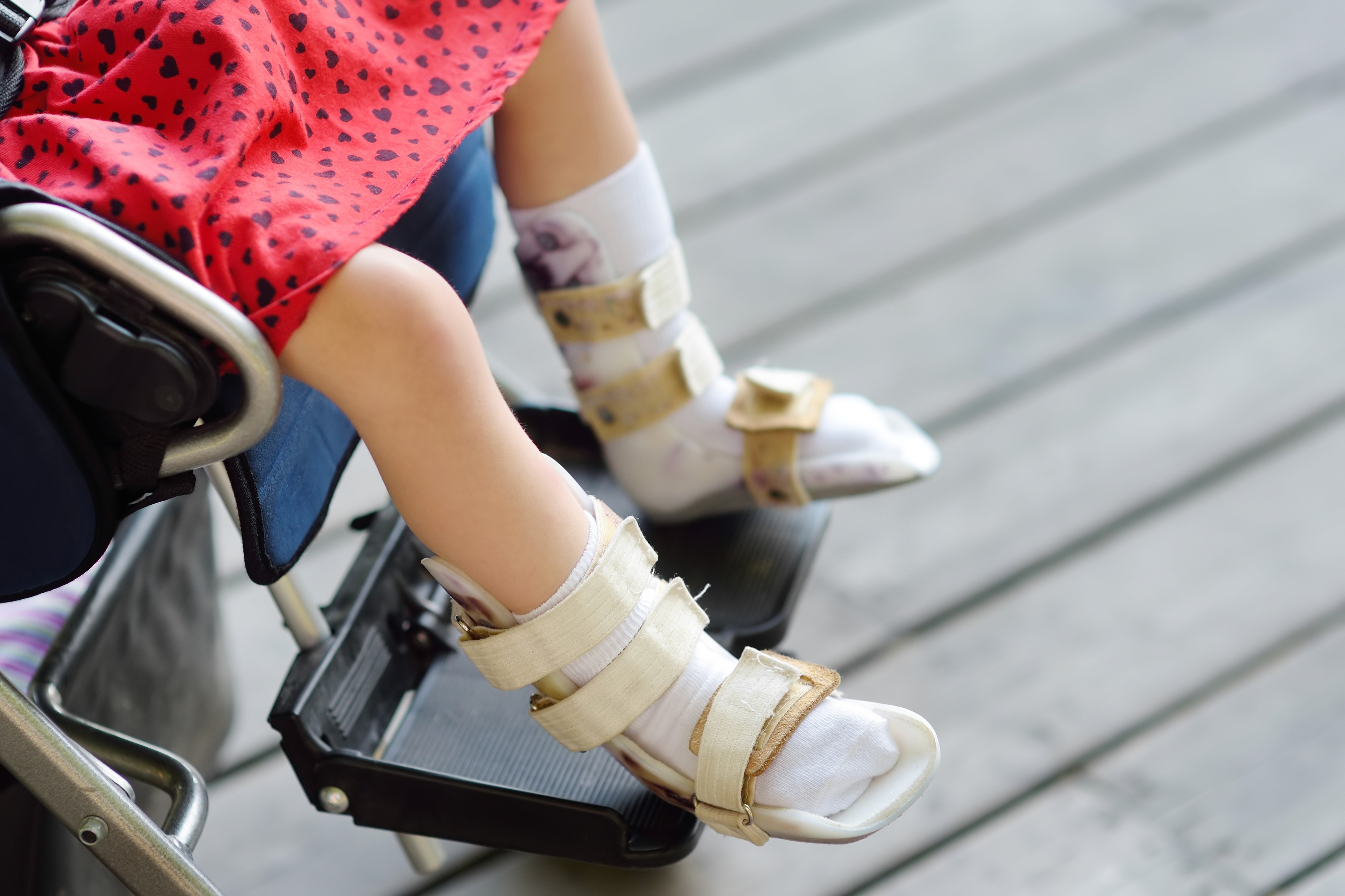 kids lying on a glass land and smiling