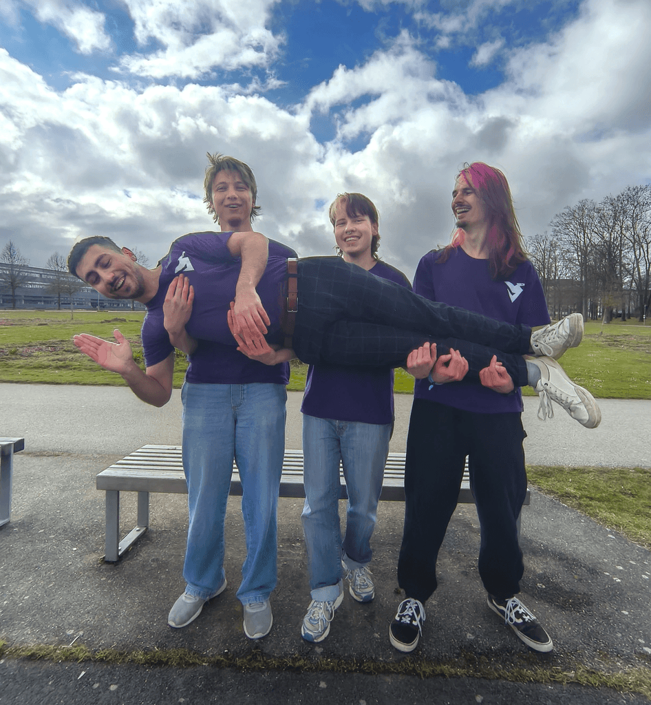 DDI team outside with Jasper, Josef and Lars holding Yoshi