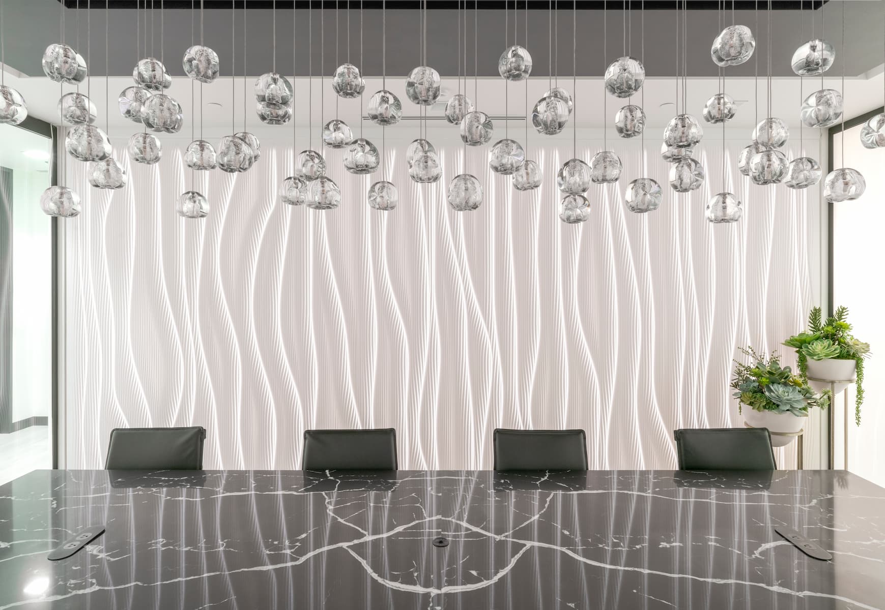 Illuminated sculptural ceiling with layered parametric geometric forms