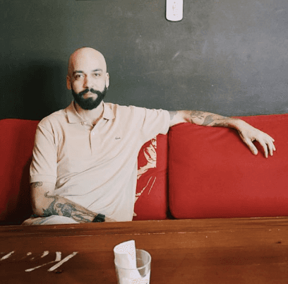 woman in black long sleeve shirt sitting on white couch