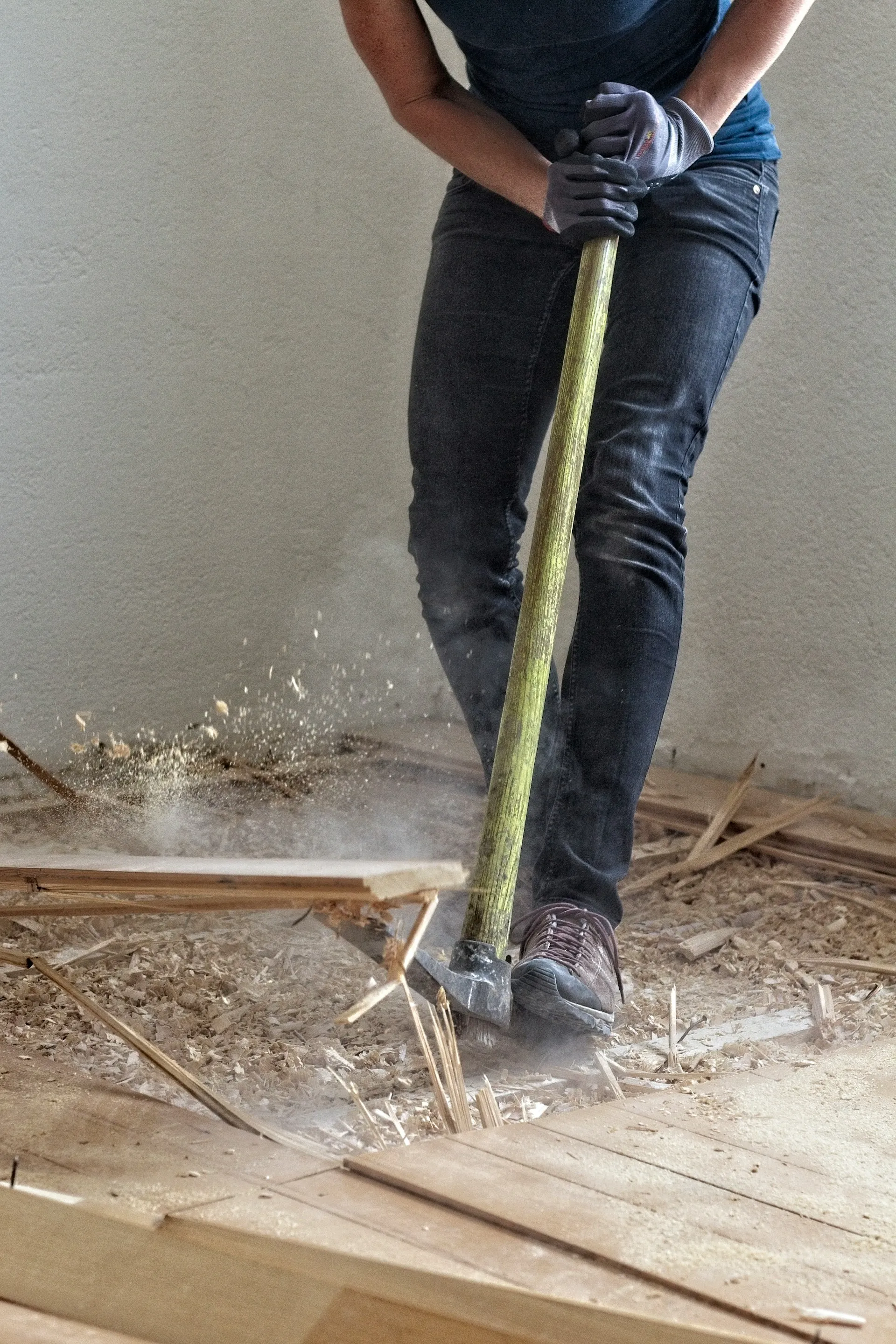 Worker measuring floor surface during renovation preparation
