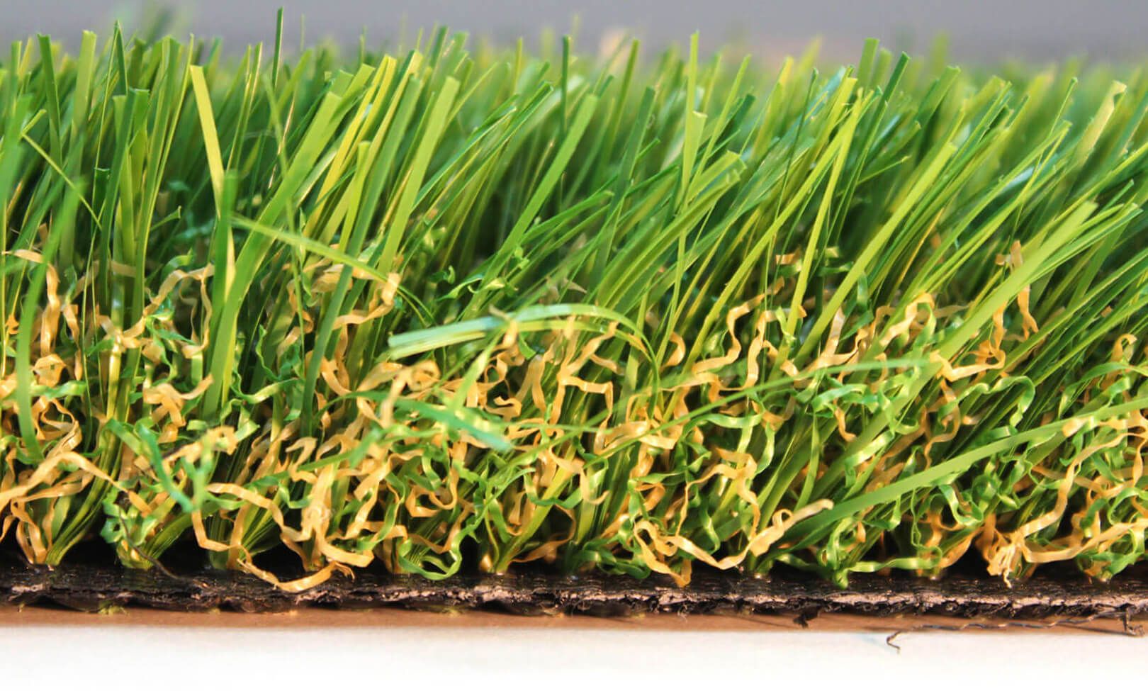 A close-up image of AGL Grass North's Pet-Friendly K9 turf that is easy to clean up and doesn't contain in-fill.