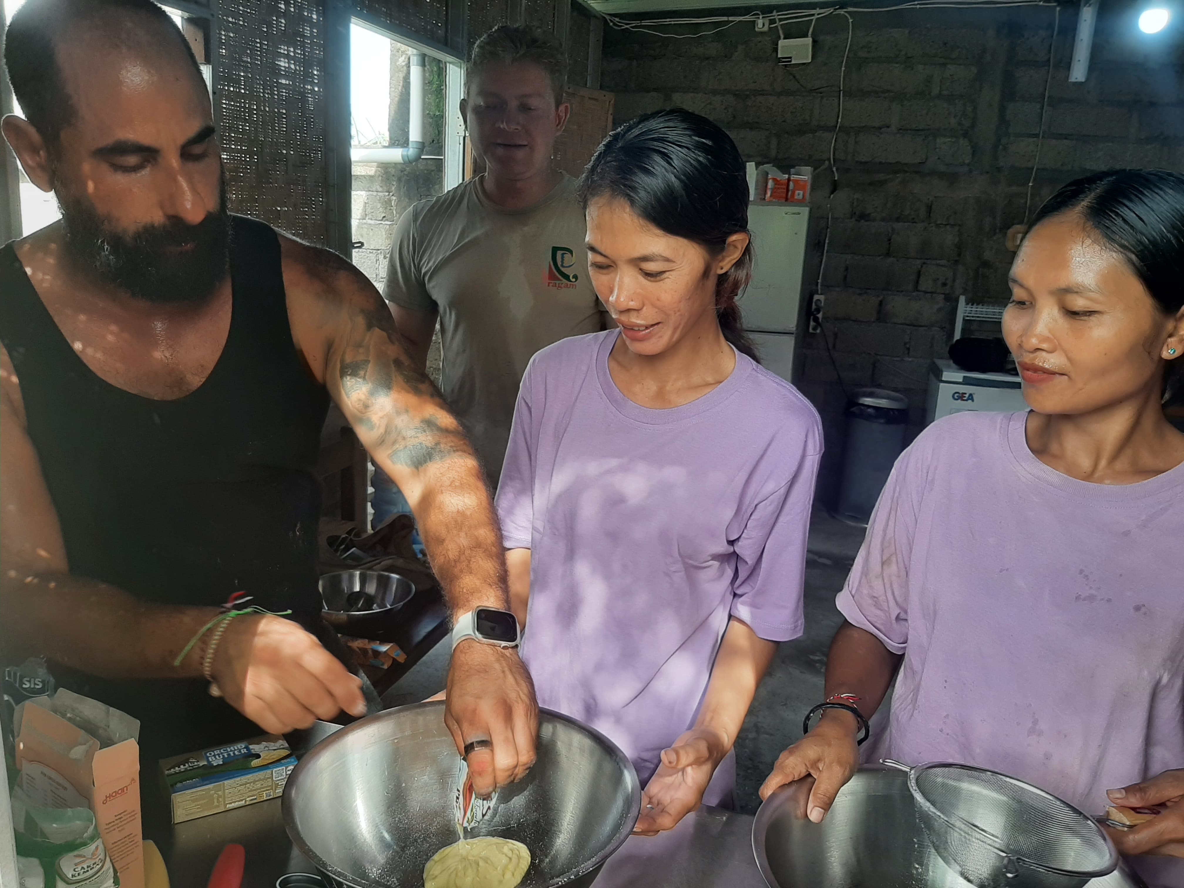 Young woman from our program rolls traditional Indonesian pastries in our women's training kitchen.
