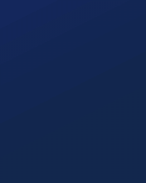 Modern home office setup with a monitor, ergonomic chair, keyboard, and indoor plants near a window with blinds.