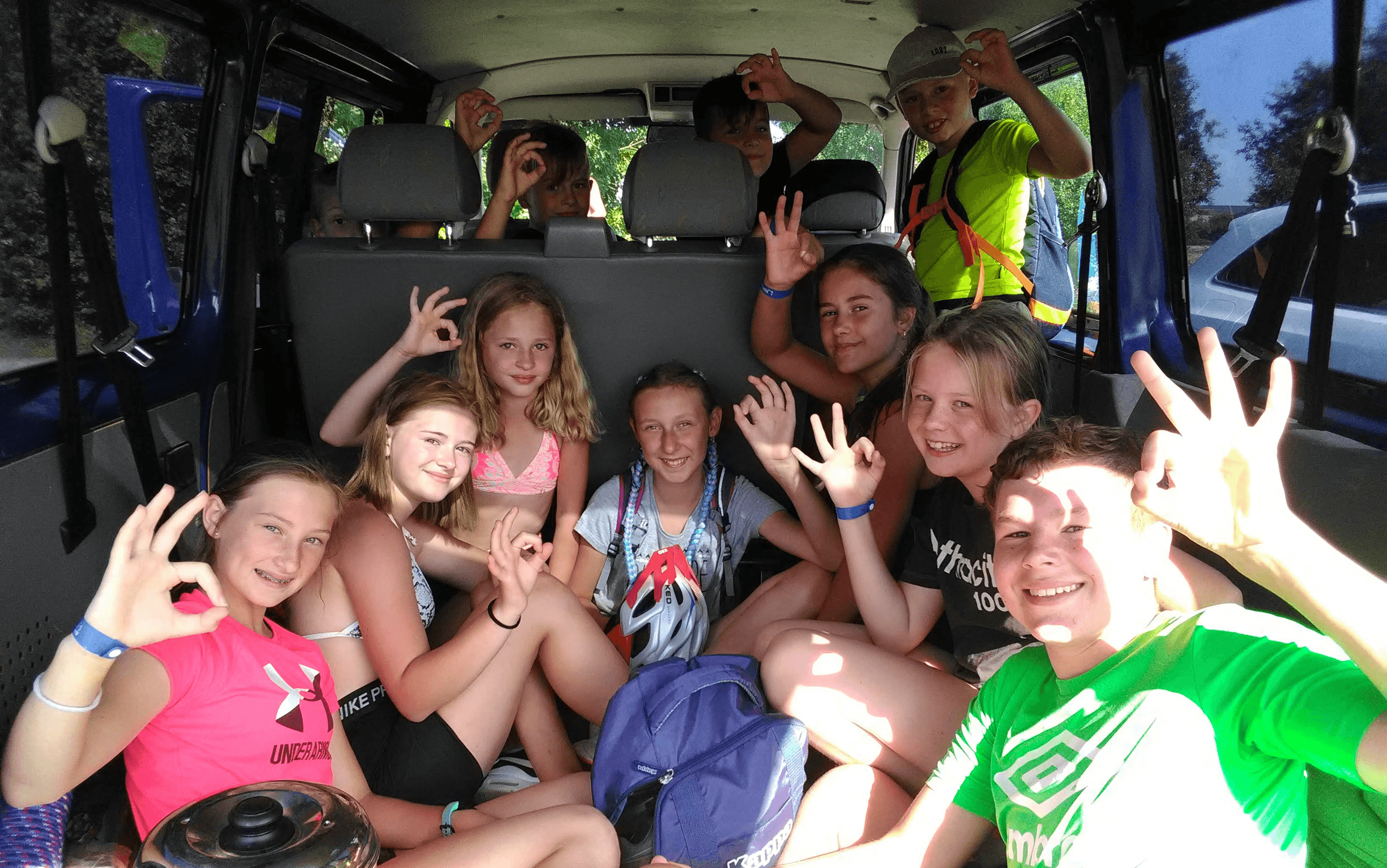 person sitting in front of body of water