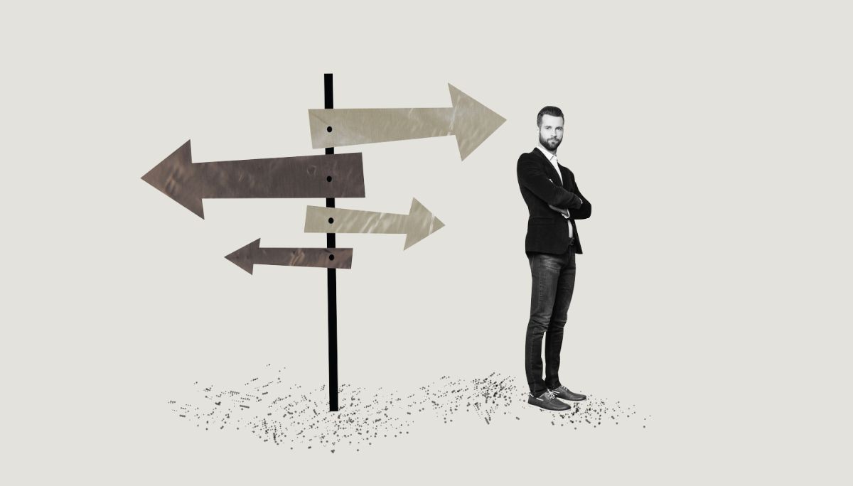 Person standing beside signpost with arrows pointing in different directions, symbolizing alternative career paths for software engineers.