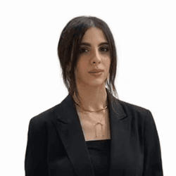 a woman with long brown hair smiling at the camera
