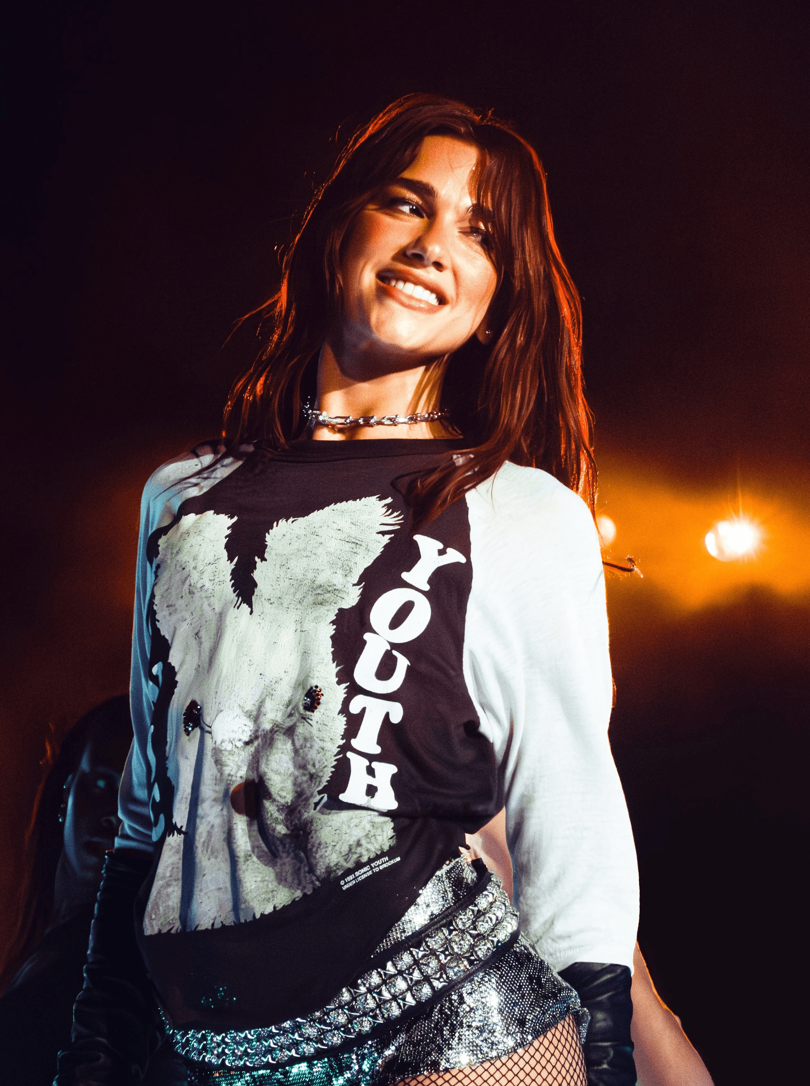 Dua Lipa performing at a concert, photographed by Lucas Aymard
