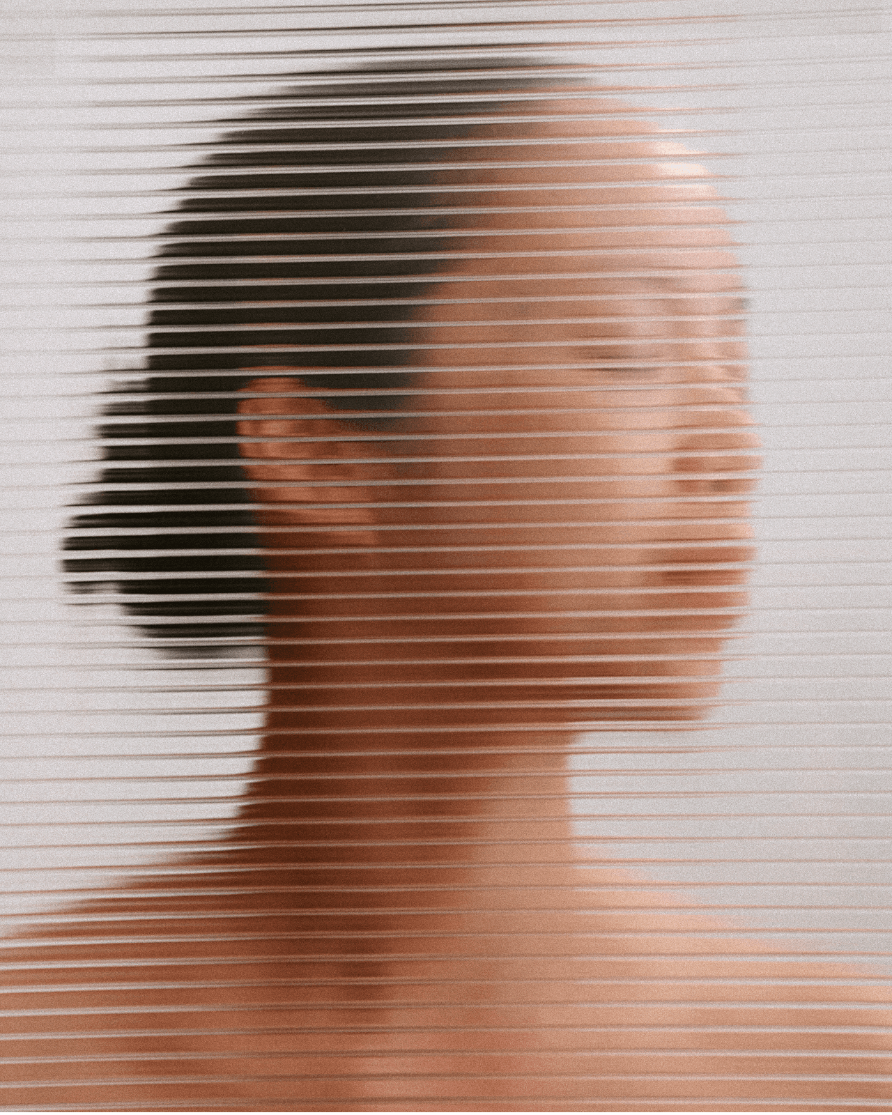 Woman relaxing in gray crop top on woven mat